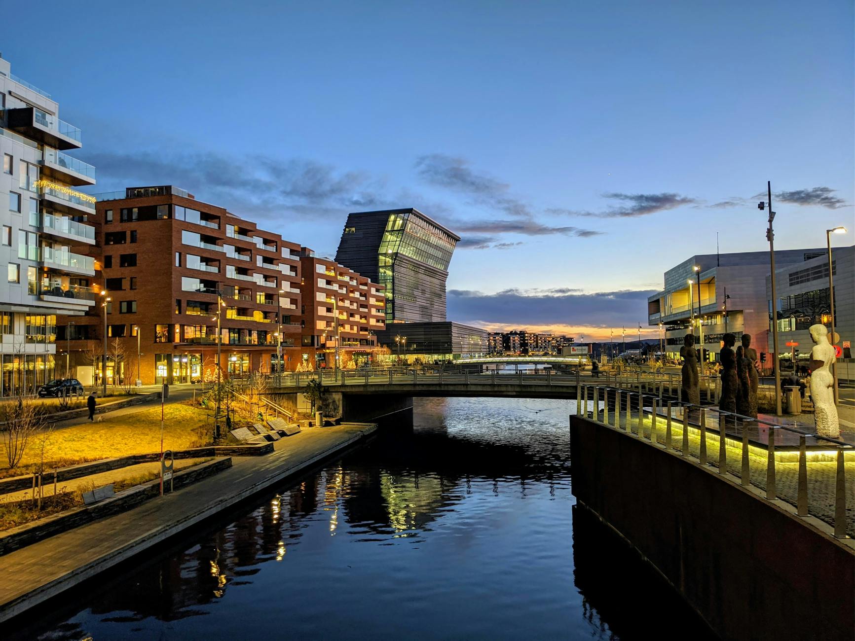 Modern Oslo cityscape reflected on the water at twilight