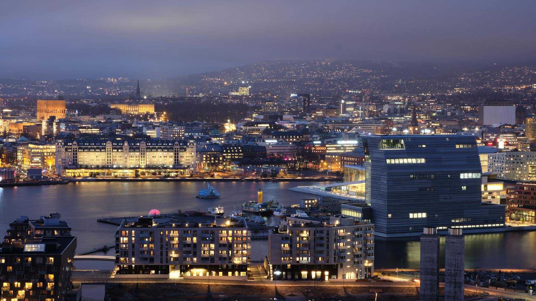 Illuminated Oslo skyline at dusk