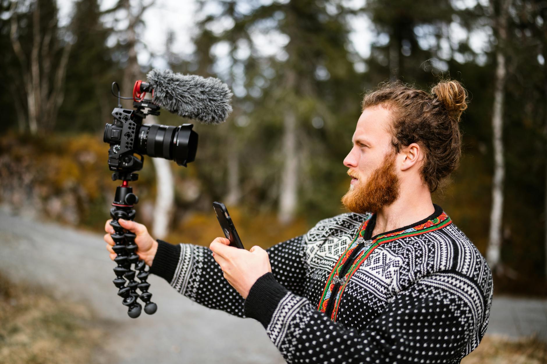 Vlogger in Norway filming outdoors with camera gear