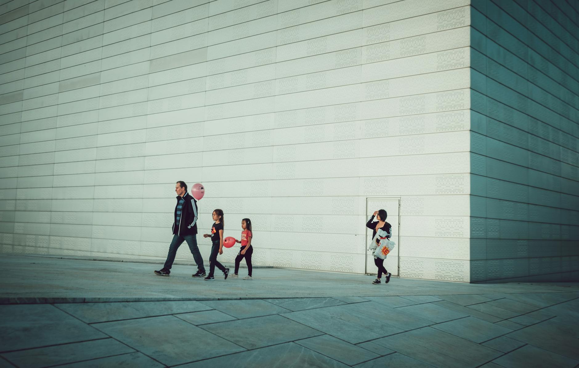 People walking beside a modern Oslo building