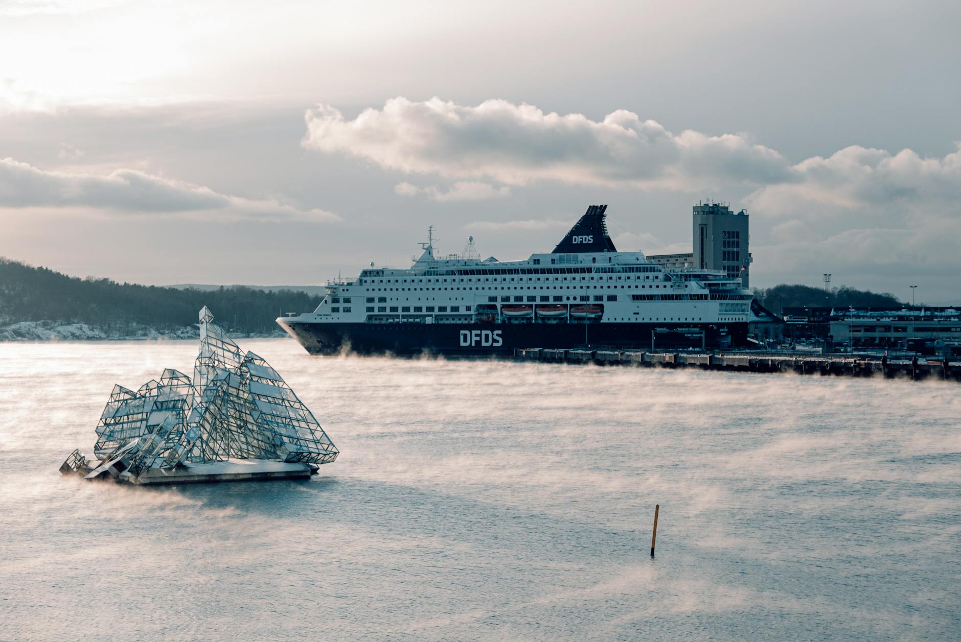 DFDS cruise ship docked in Oslo Harbor with icy water