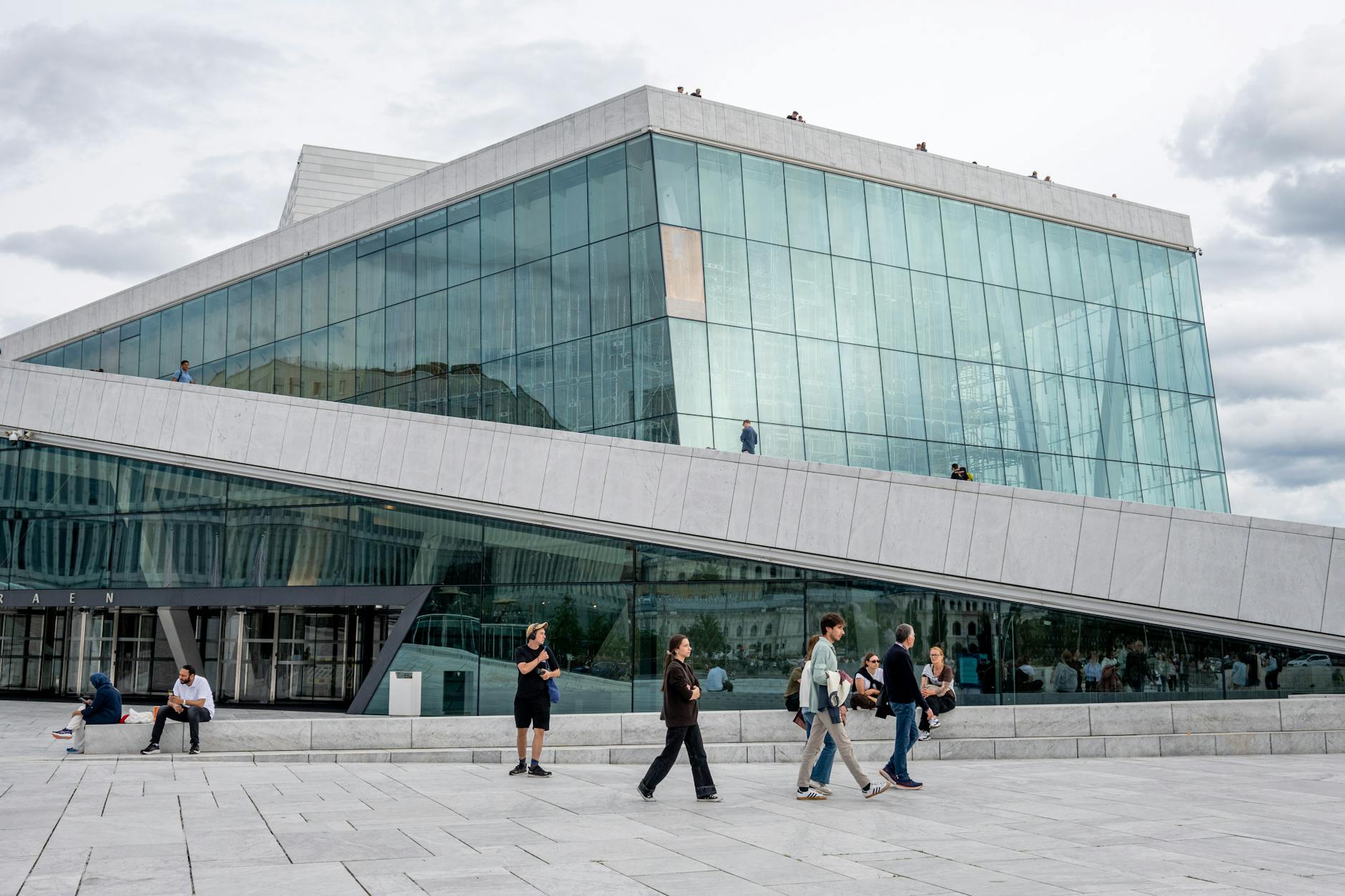 Visitors walking outside the Oslo Opera House
