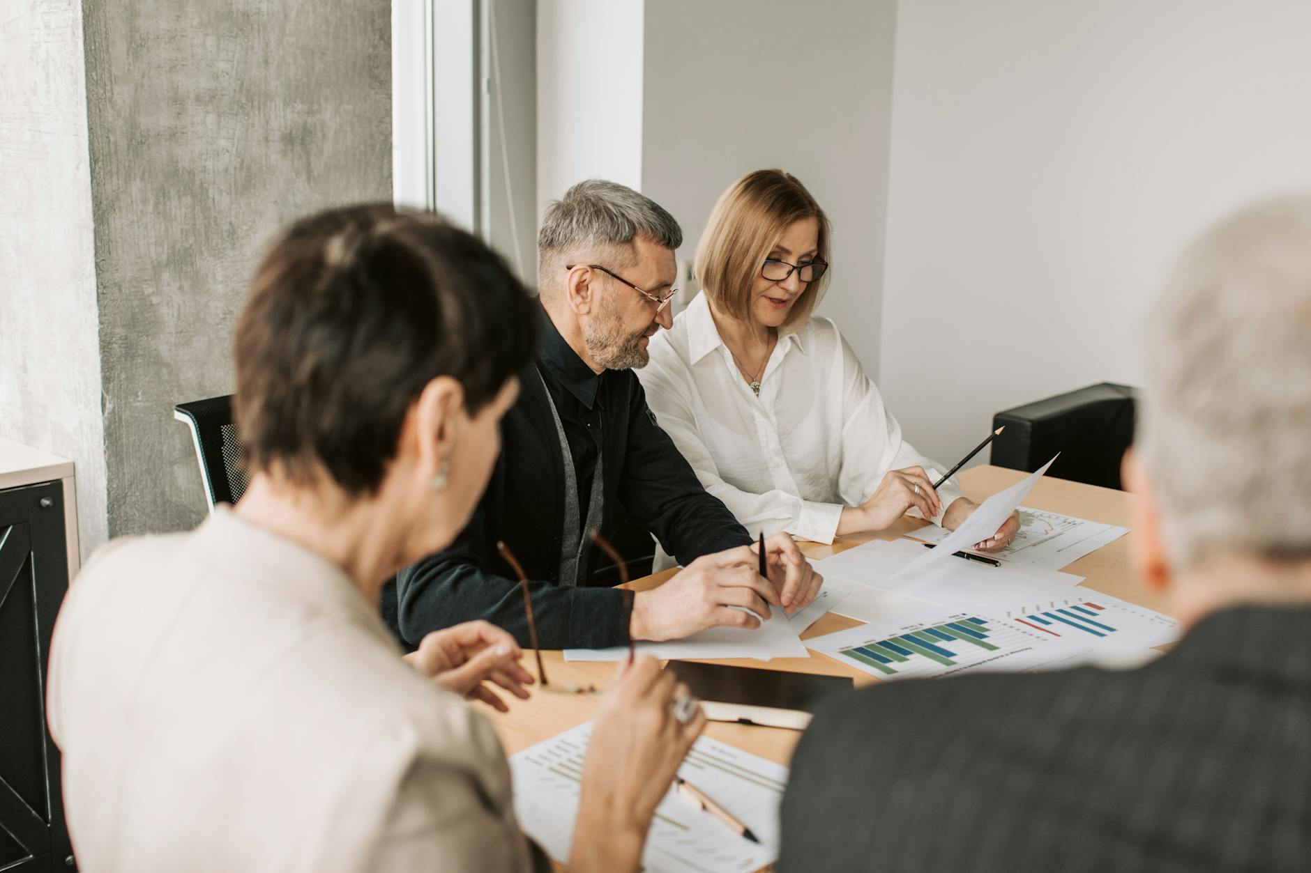 Business team analyzing financial documents in an office