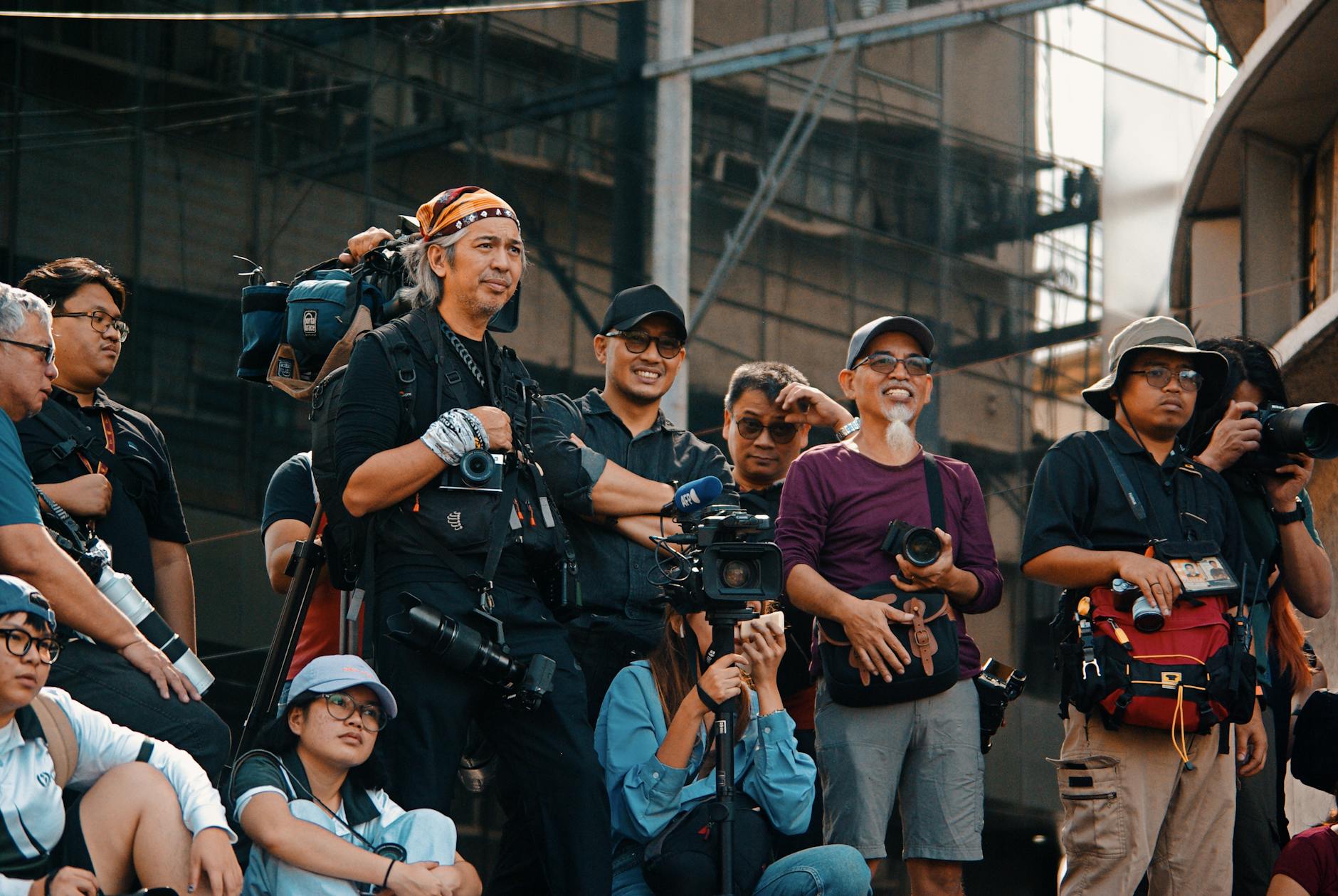 Photographers capturing an outdoor event