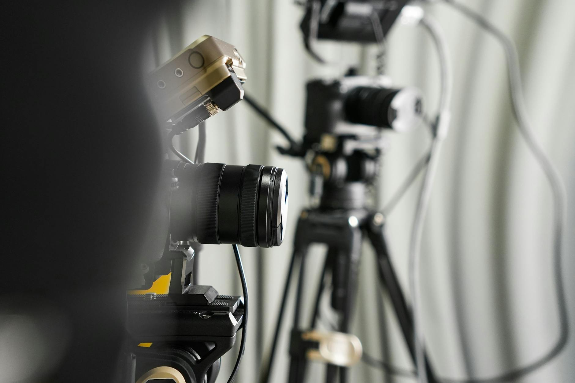 Professional video cameras on tripods in a studio