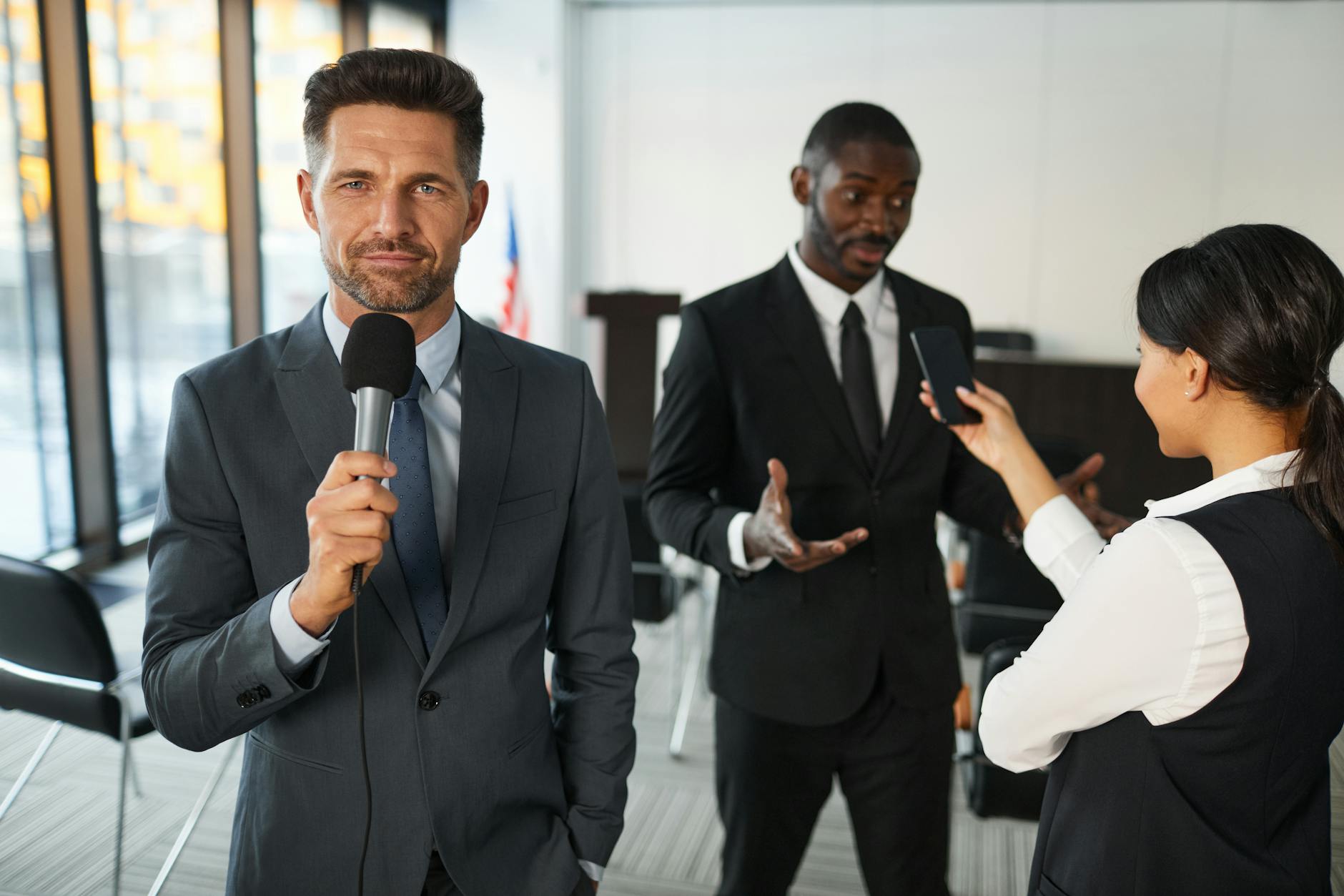 Journalist interviewing a professional in a conference room