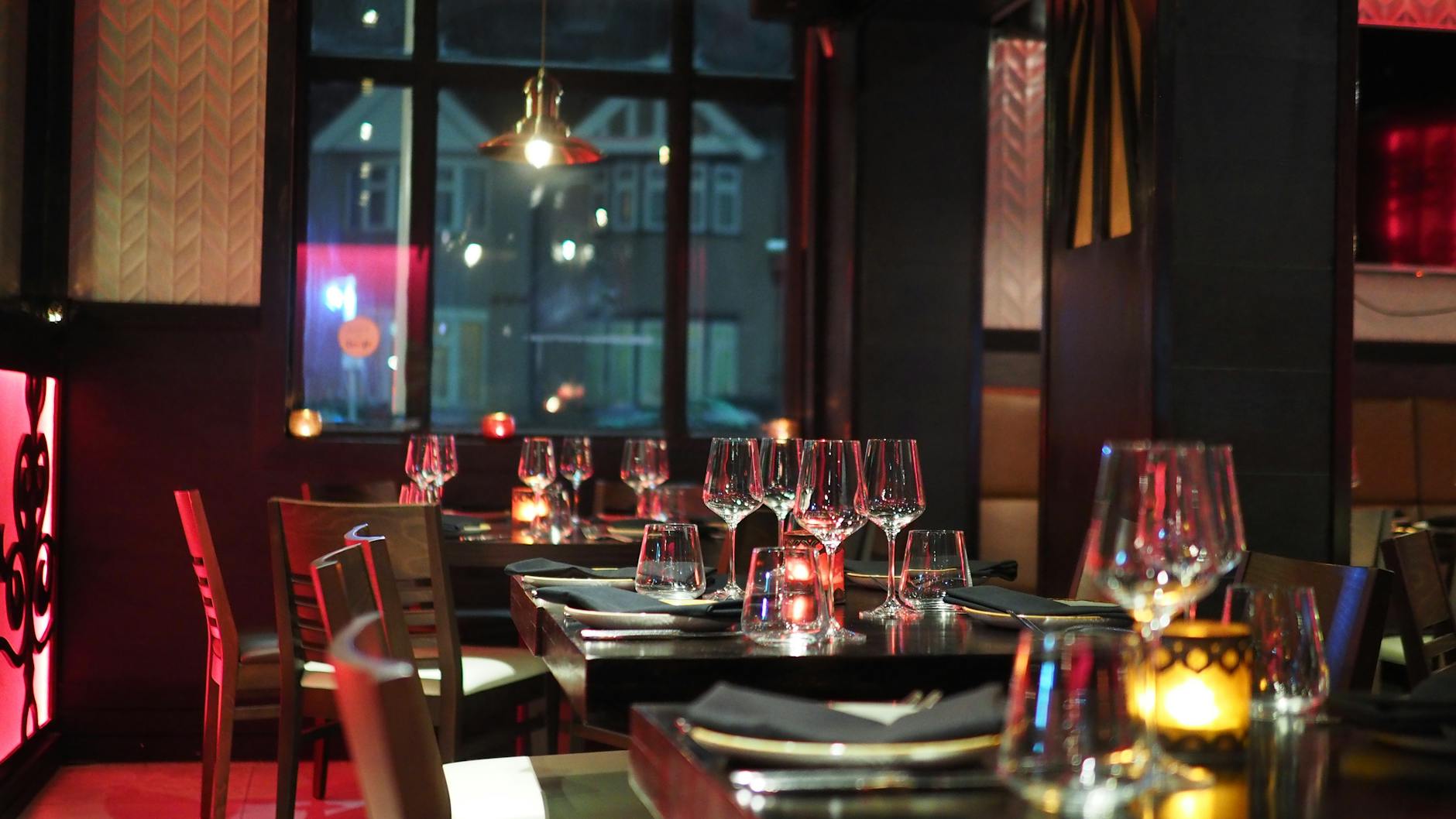 Elegant restaurant interior with candlelit table setting