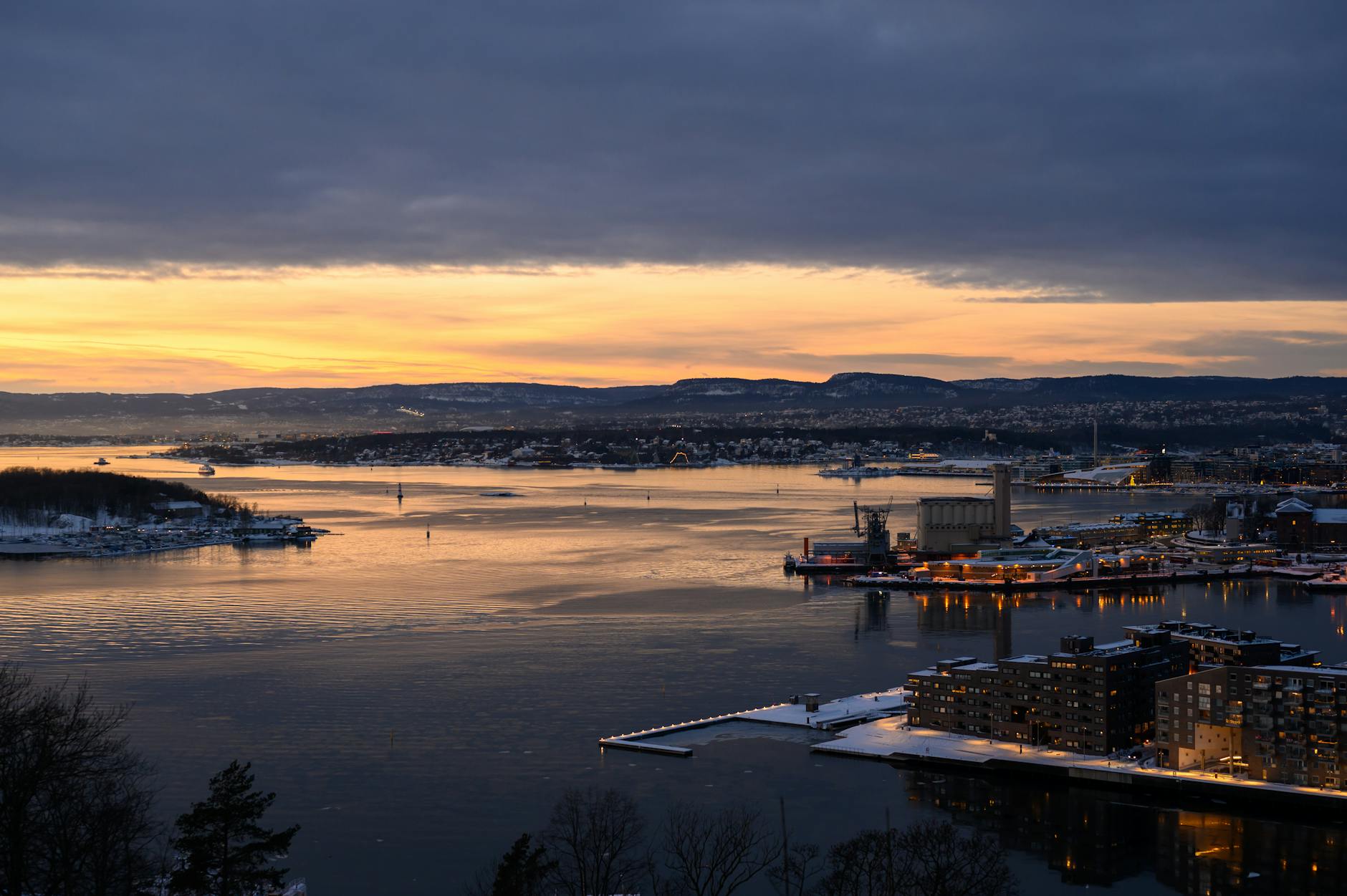 Aerial sunset over Oslo Fjord and city skyline