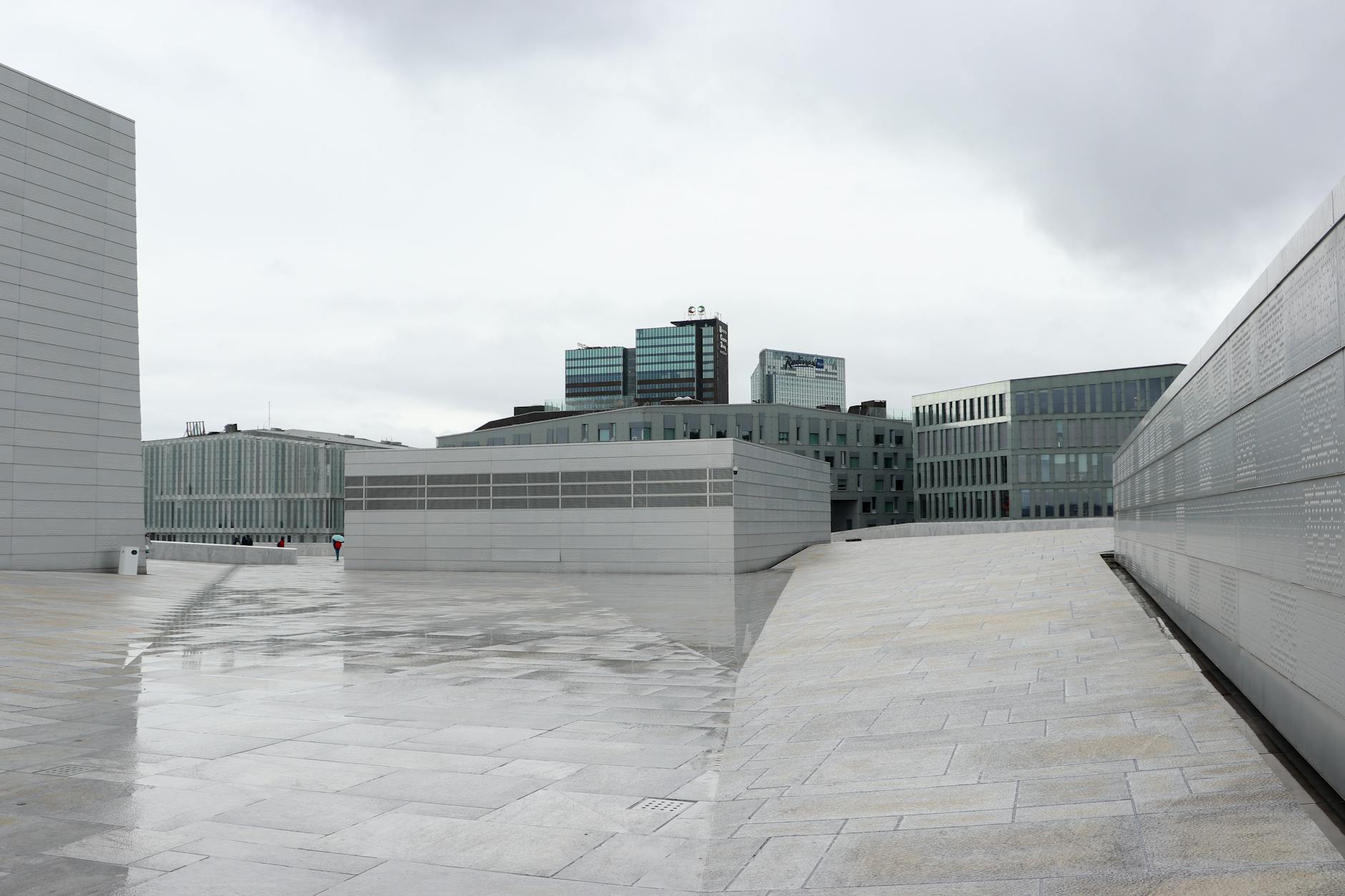 Modern Oslo Opera House and urban skyline