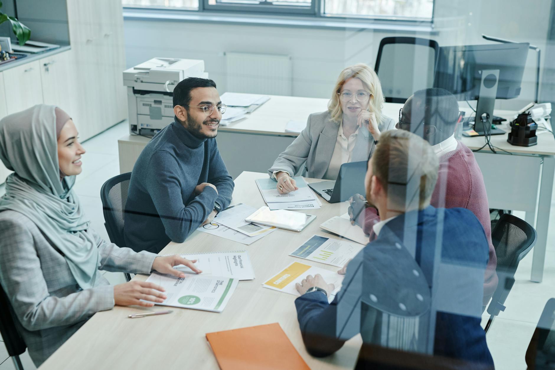 Professionals collaborating in a modern office meeting