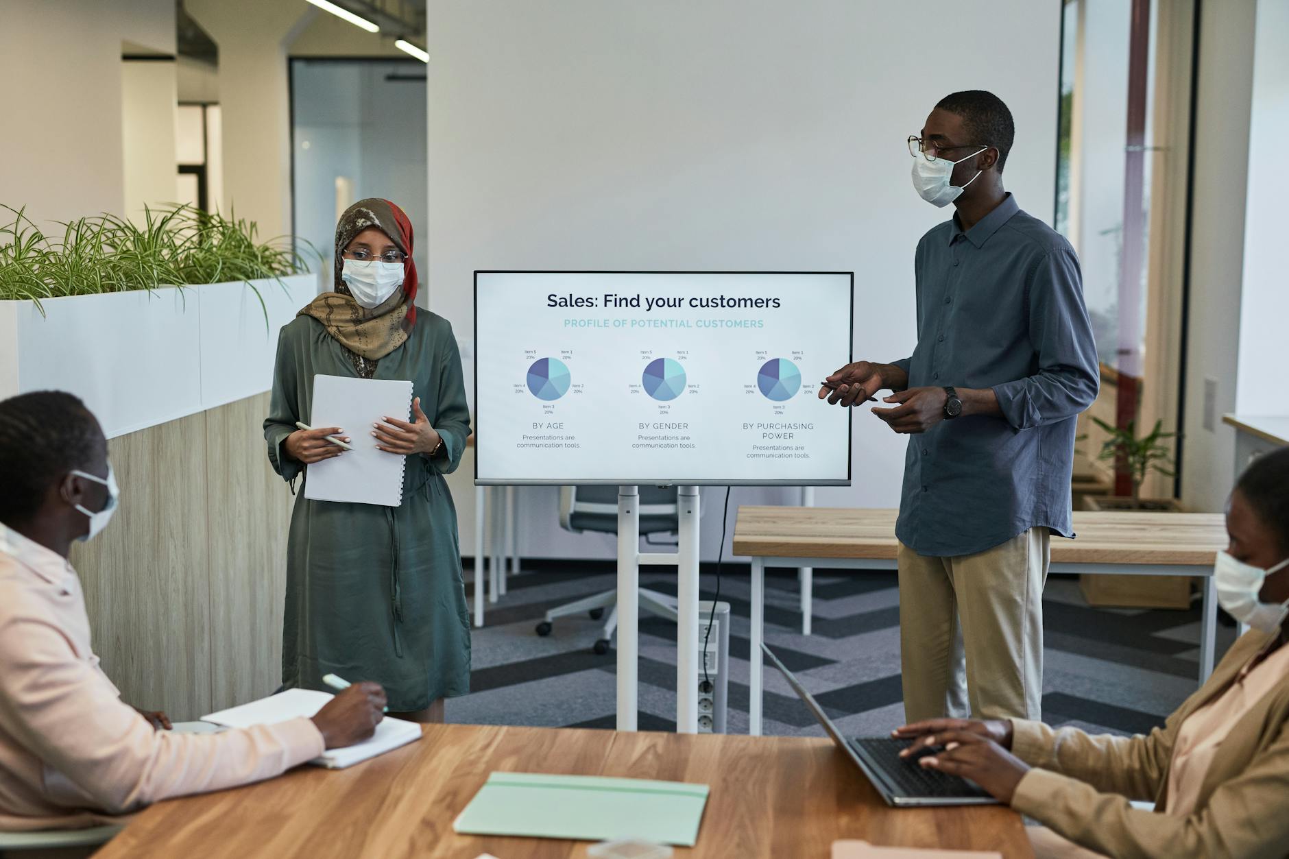 Business team reviewing sales strategy charts in an office