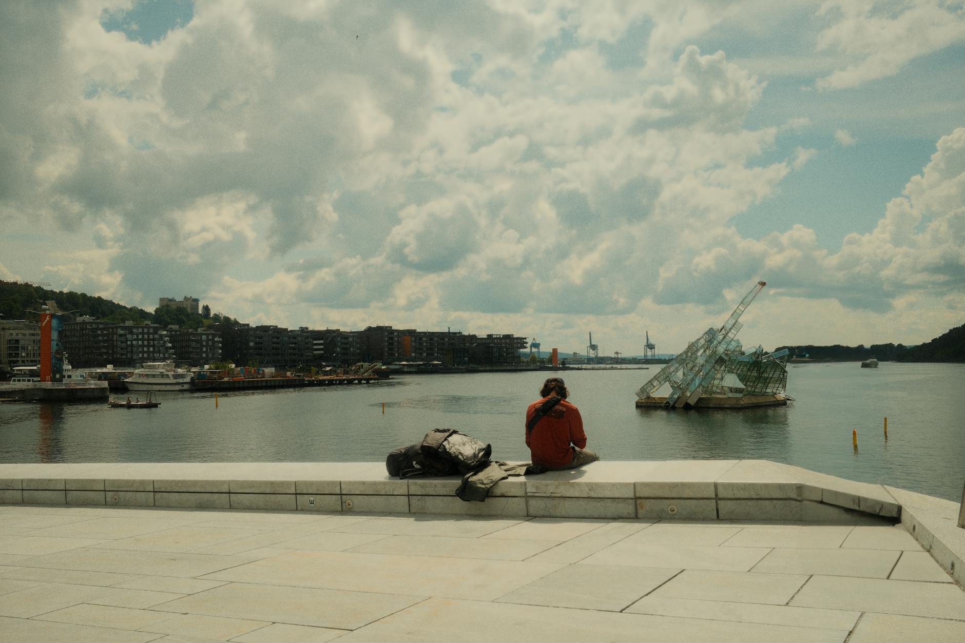 Person standing alone by the Oslo waterfront