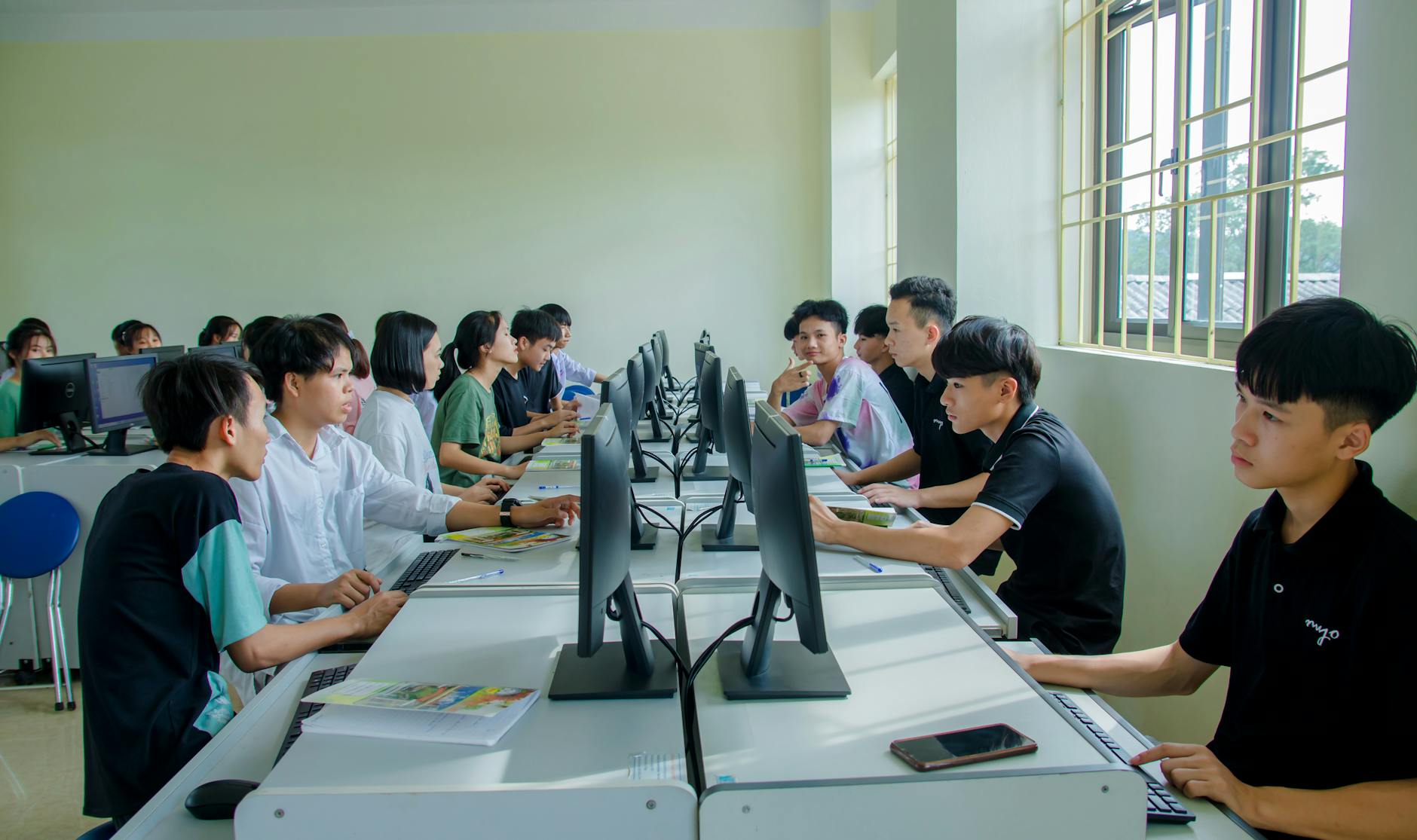Students studying together in a computer classroom