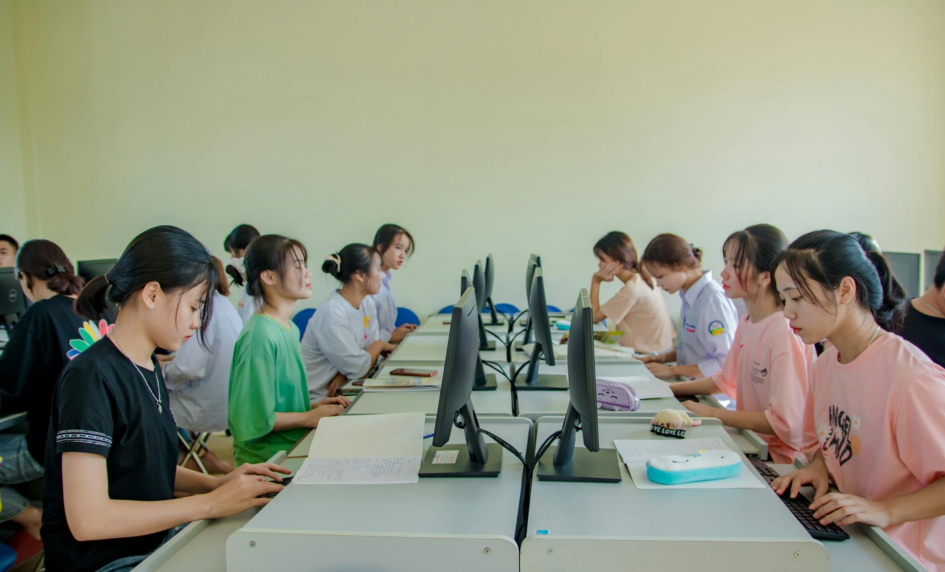 Students working at computers in a classroom