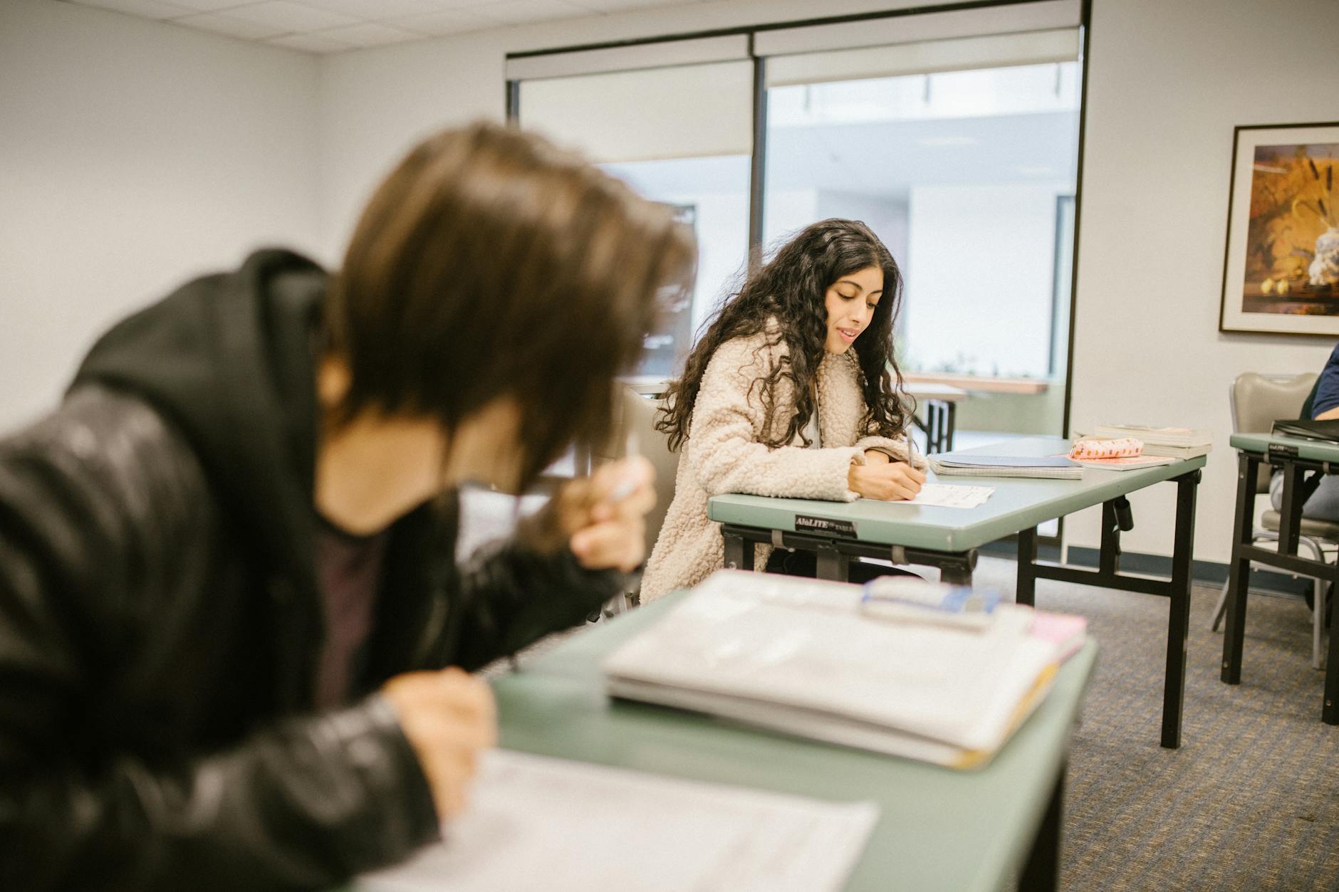 Students focused on an exam in a classroom