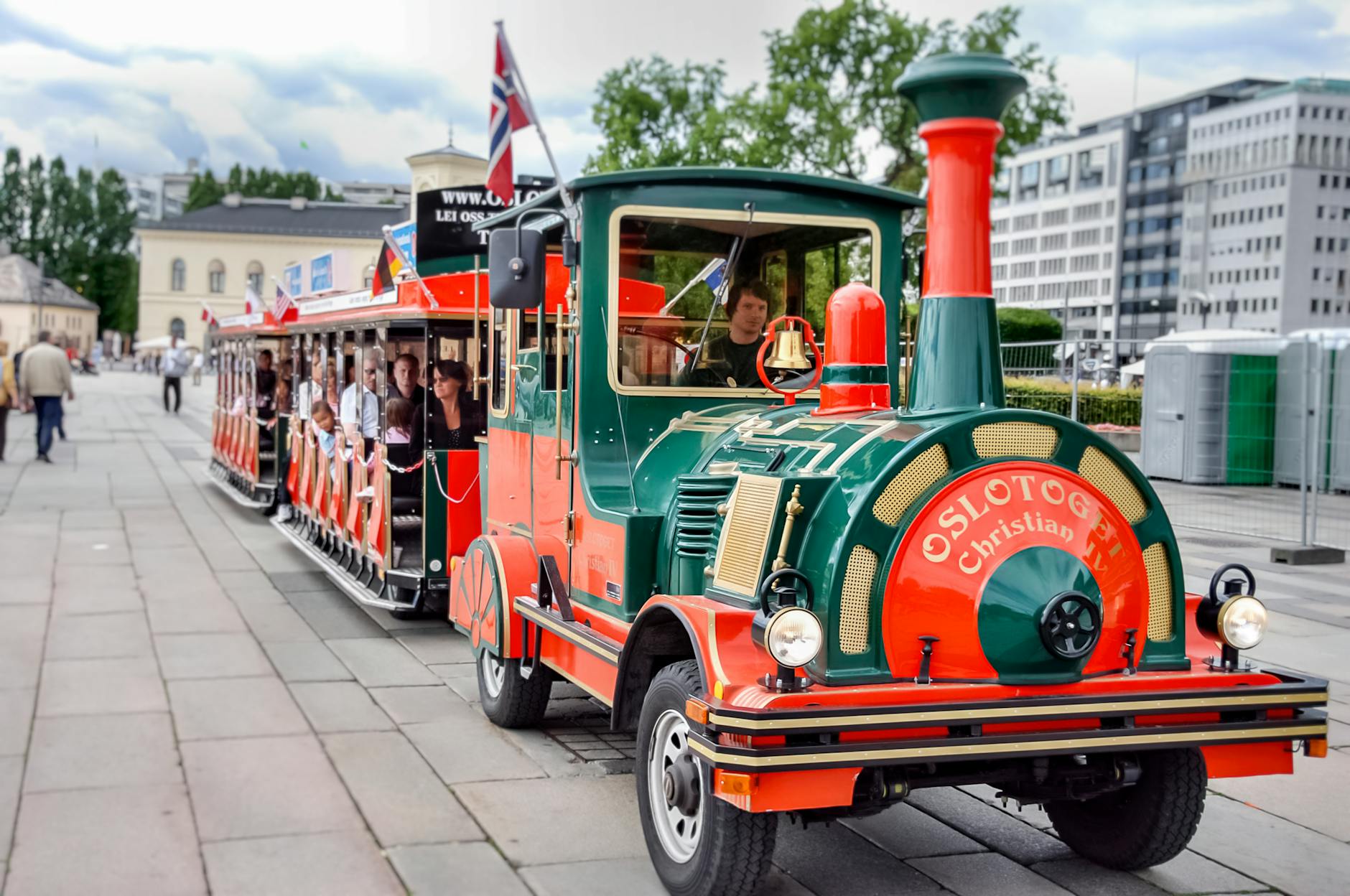 Sightseeing train carrying passengers through Oslo