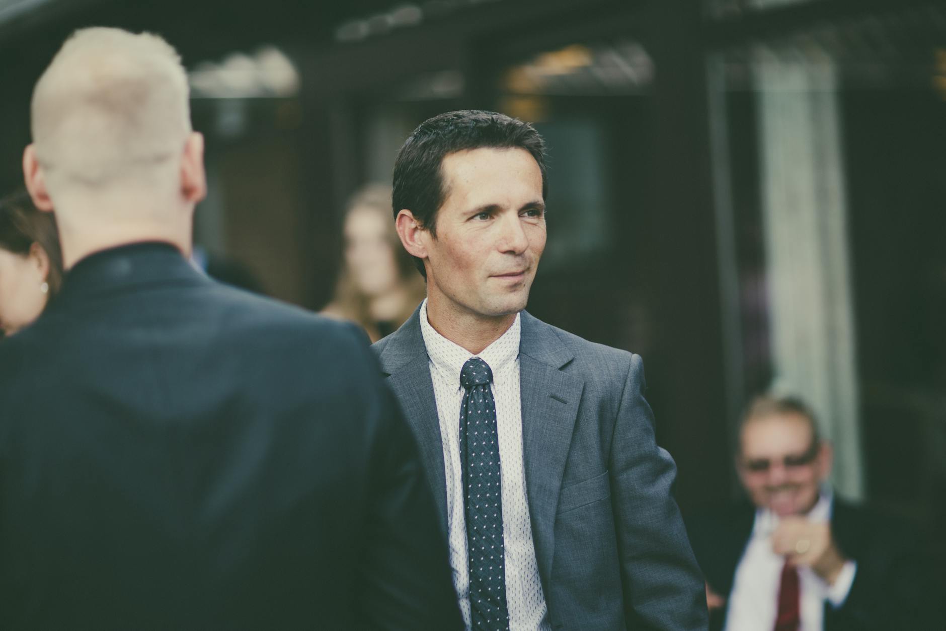 Business professionals networking at an outdoor event