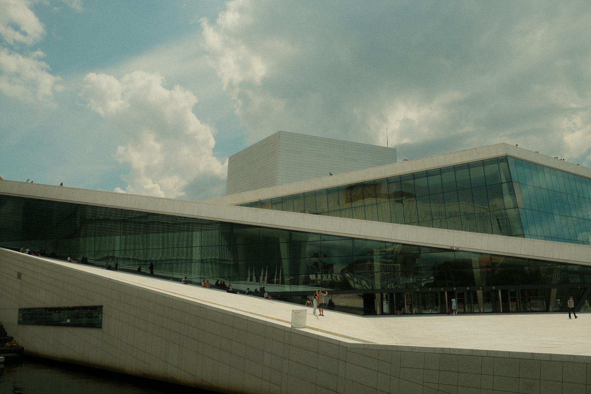 Oslo Opera House against a dramatic sky