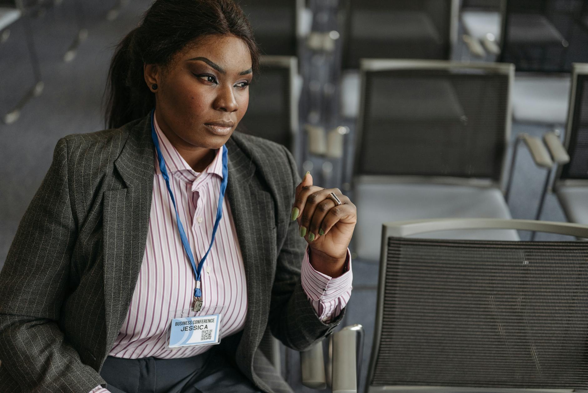Trade-show attendee wearing a blazer and name tag
