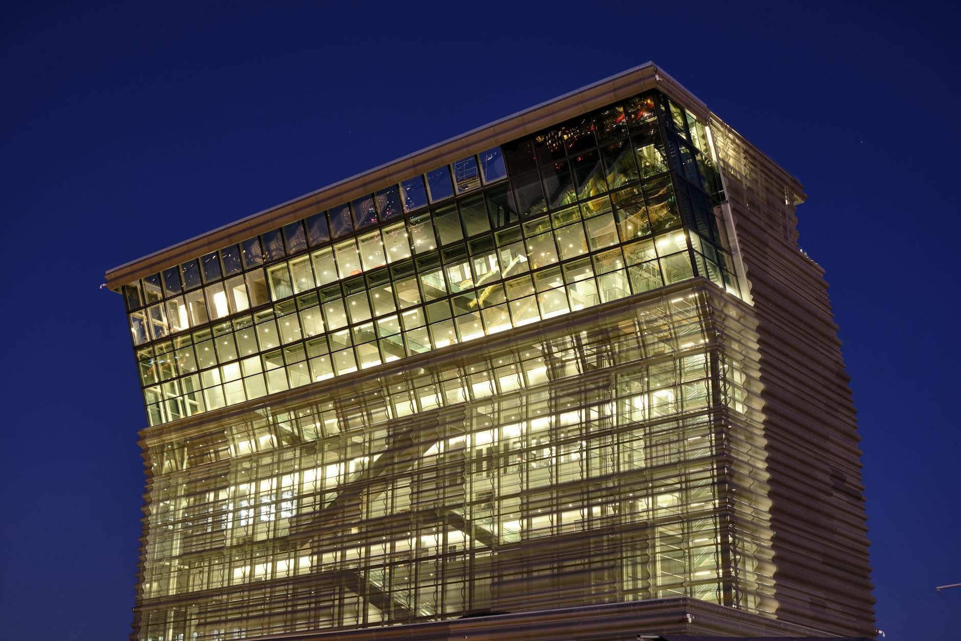 Illuminated Oslo glass office building at night