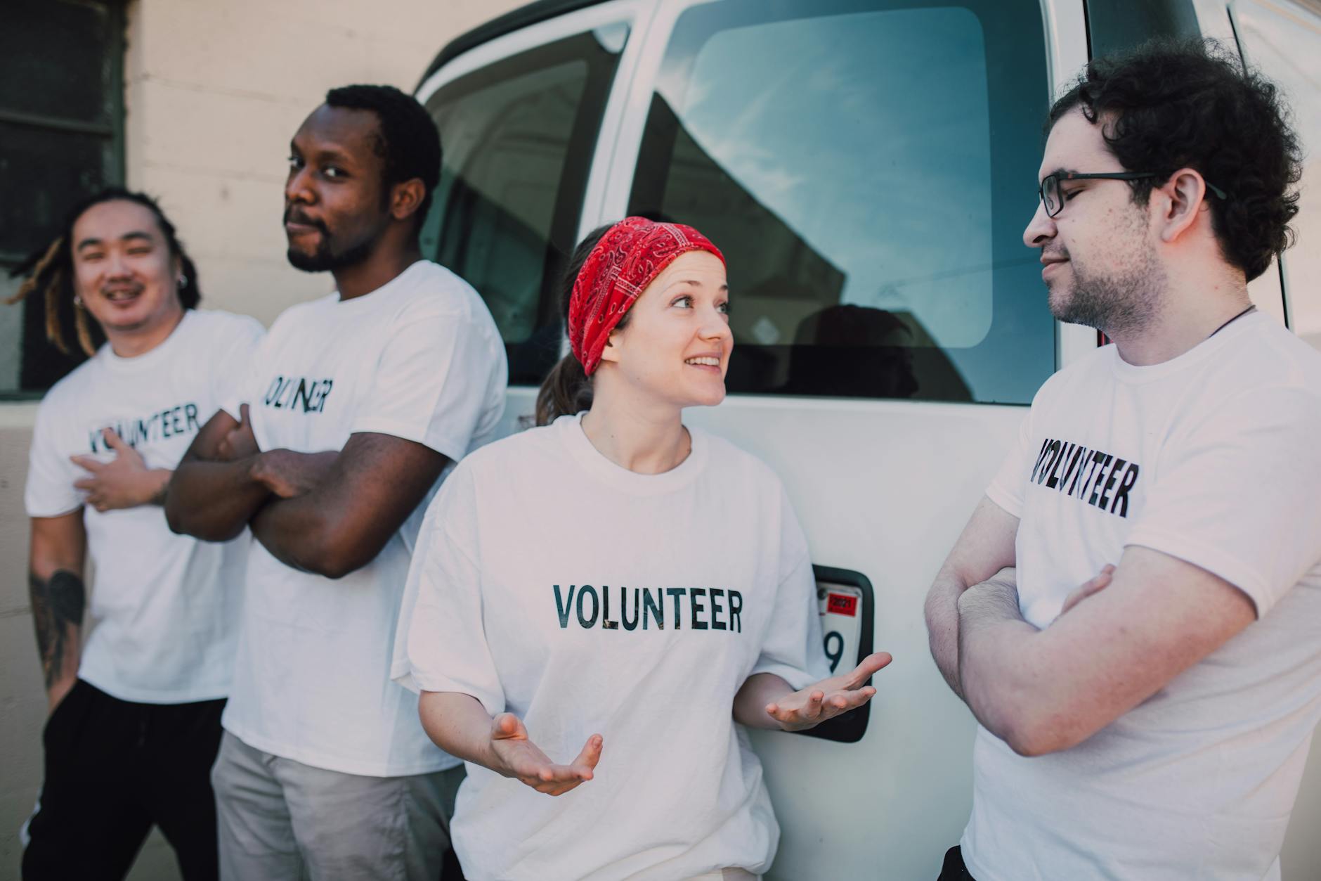 Volunteers coordinating beside a van
