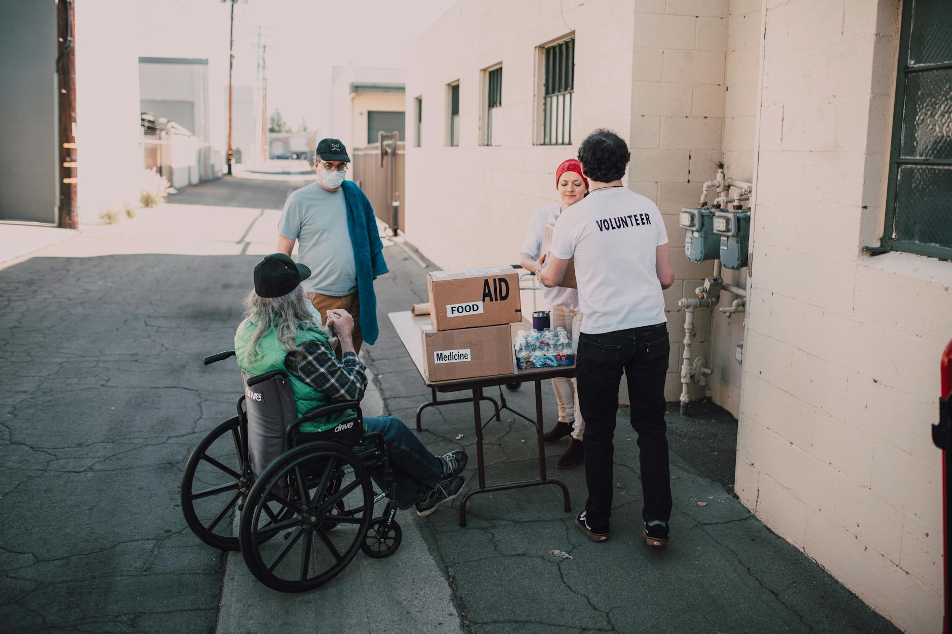 Volunteers distributing food and medicine supplies