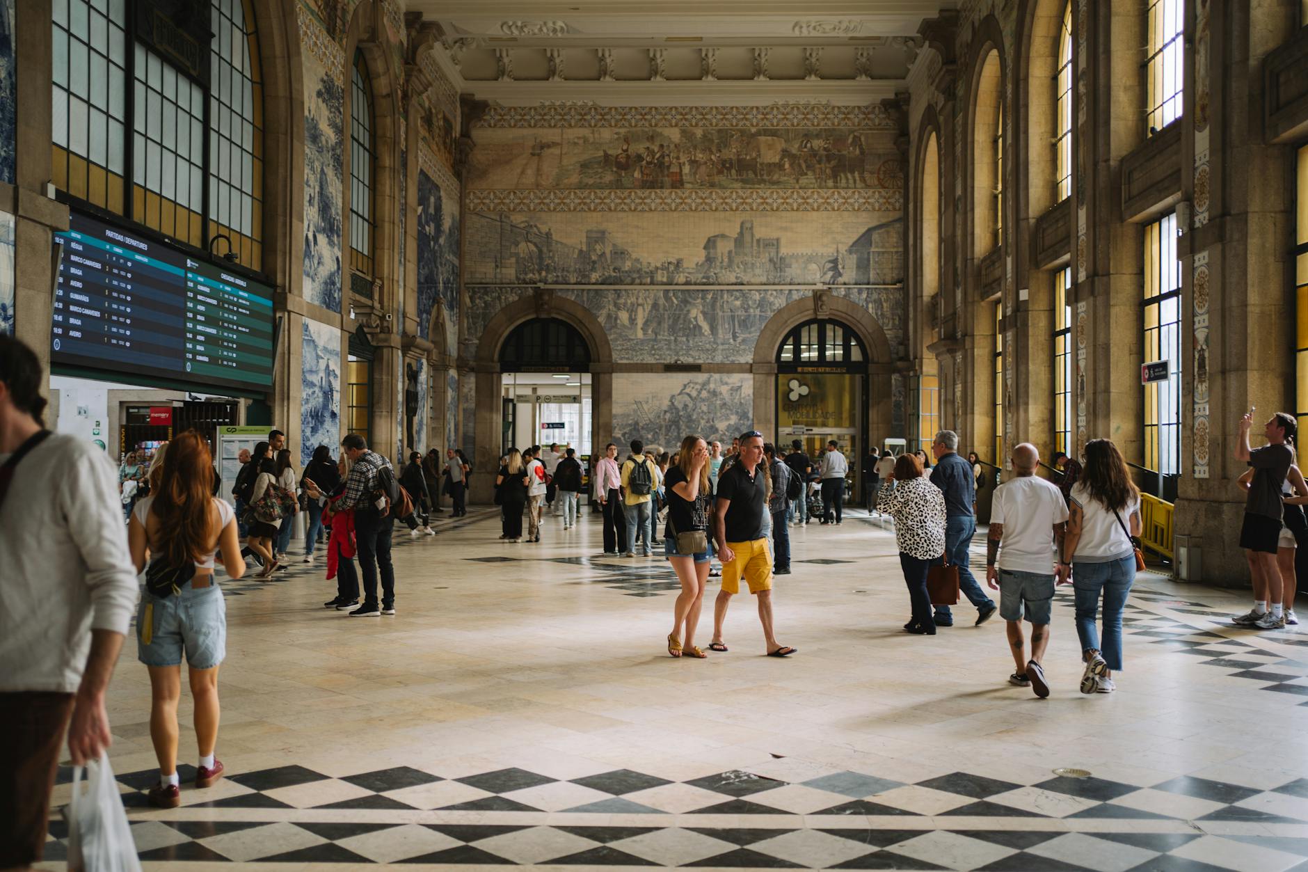 Interior hall of Sao Bento Station with people exploring