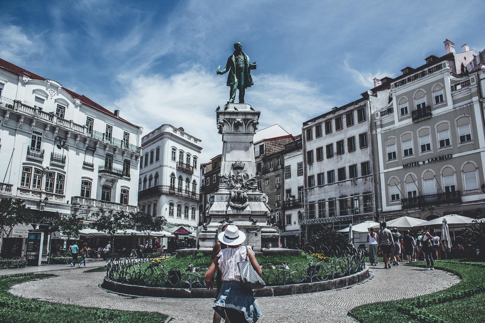 Busy Porto square with monument and surrounding buildings