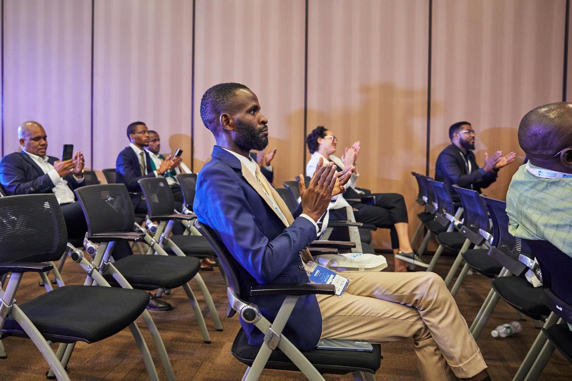 Conference audience clapping during a business event