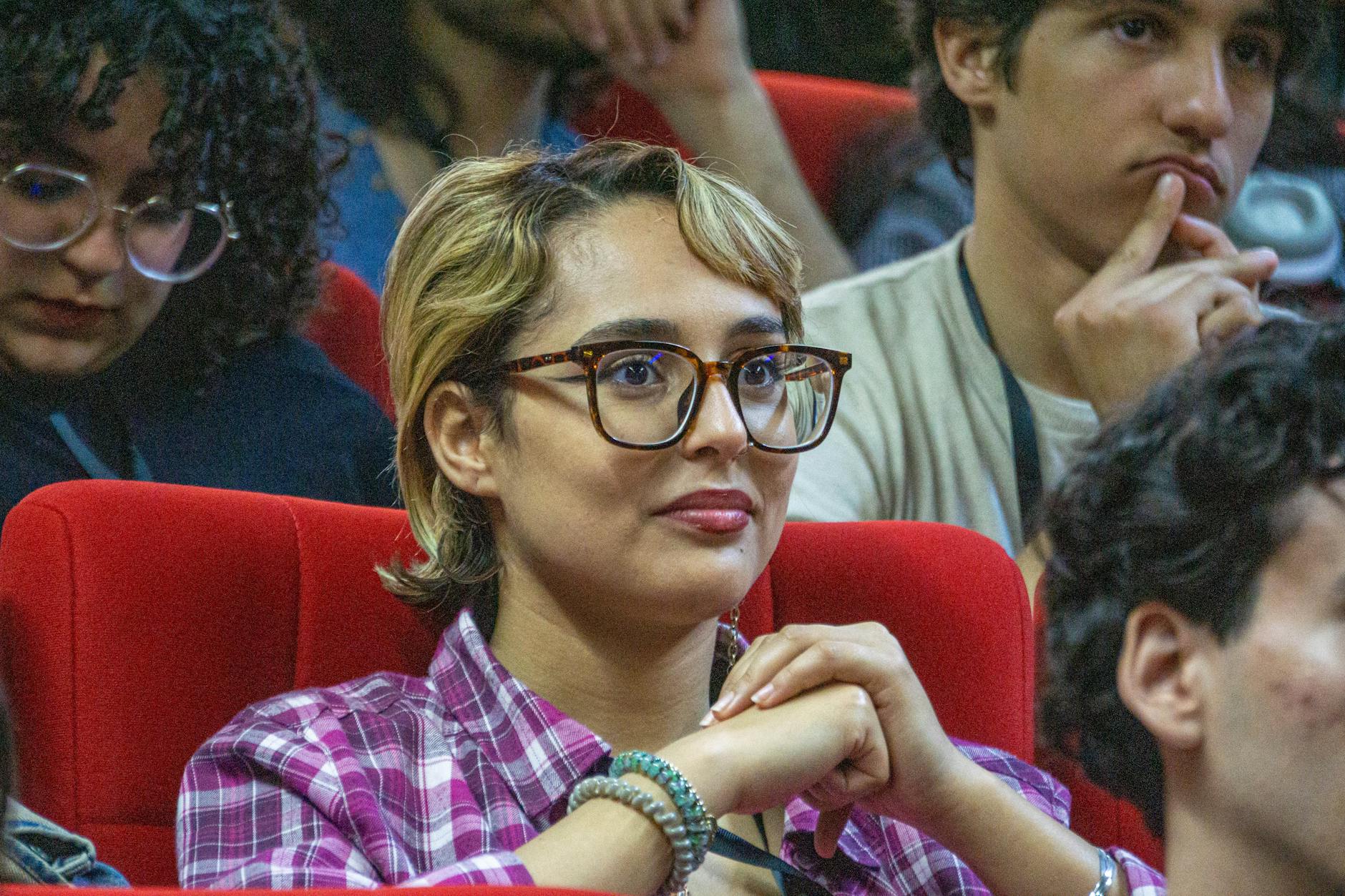 Conference attendees listening during a session in a lecture hall