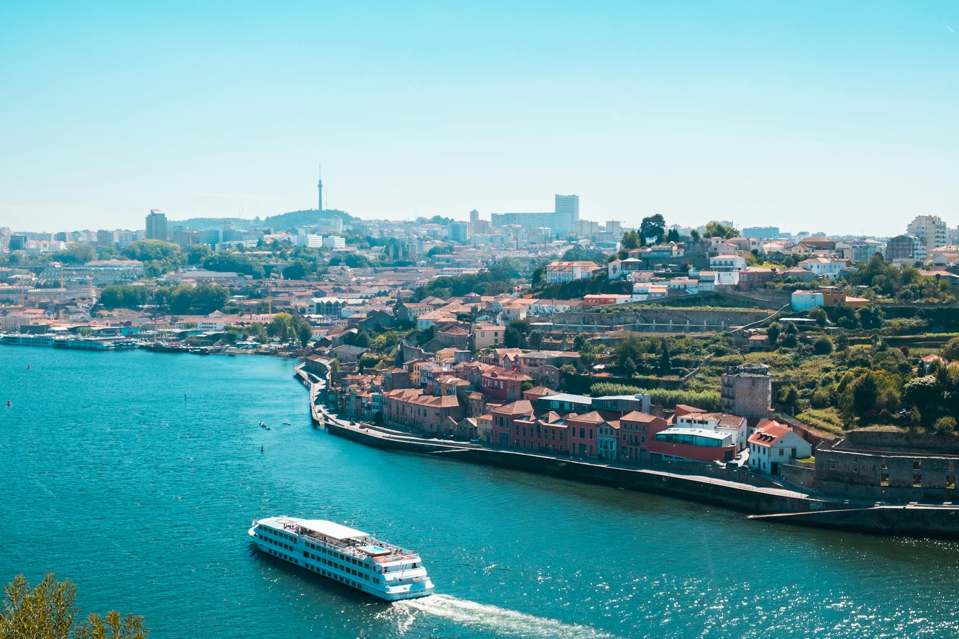 Aerial view of Porto with a river cruise ship on the Douro River