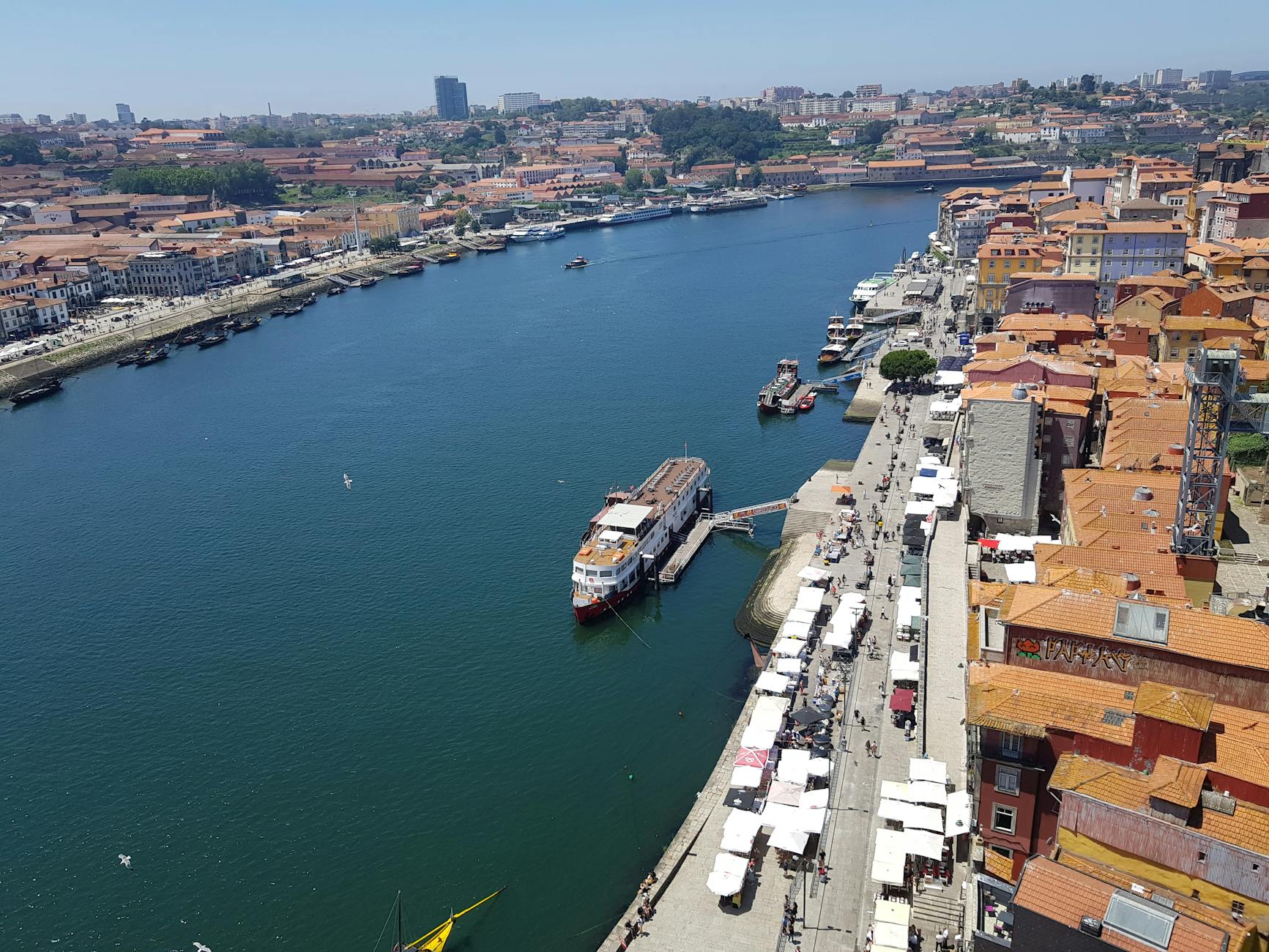 Aerial view of Porto with boats docked along the riverside