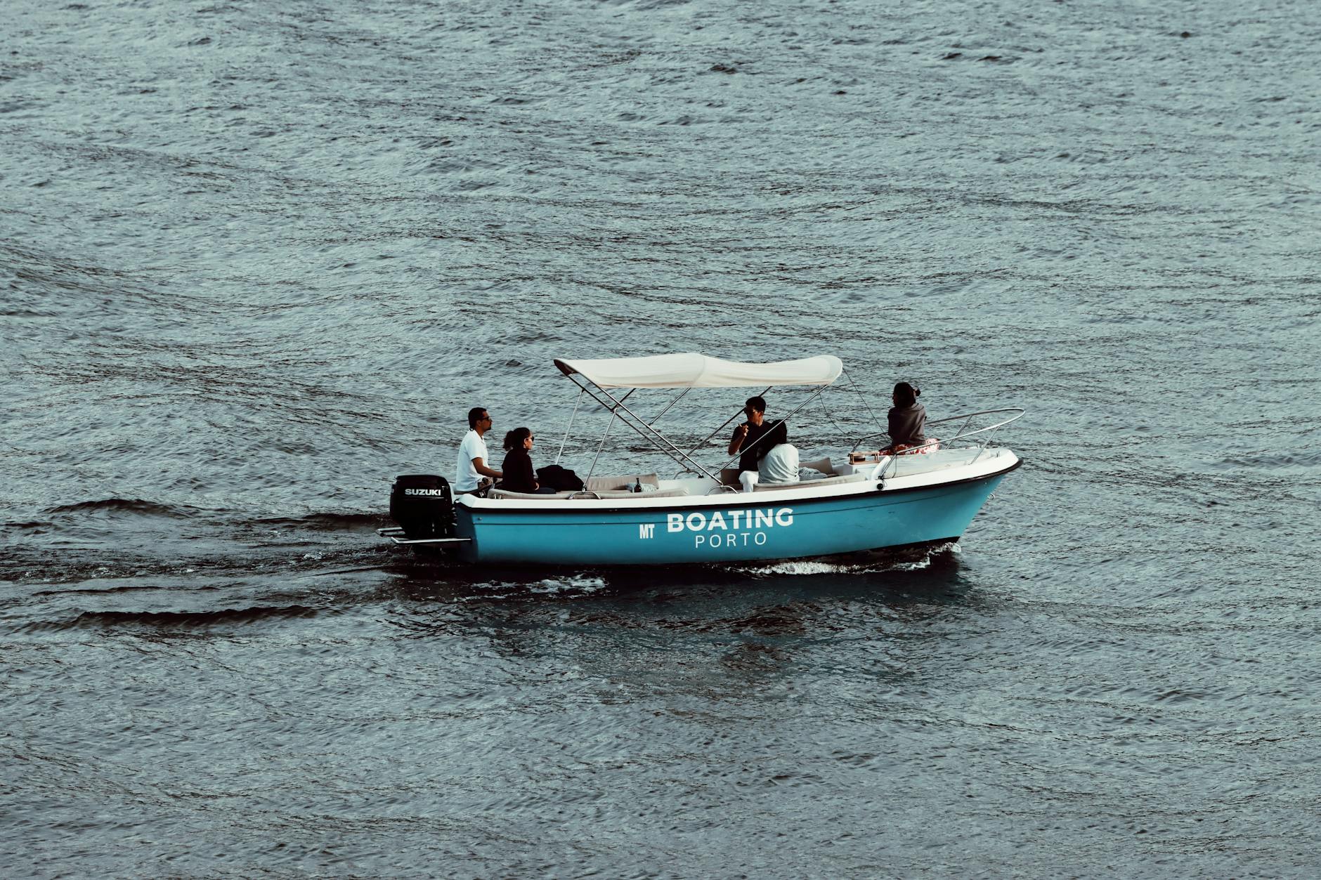 People enjoying a leisurely boat ride on the Douro River in Porto
