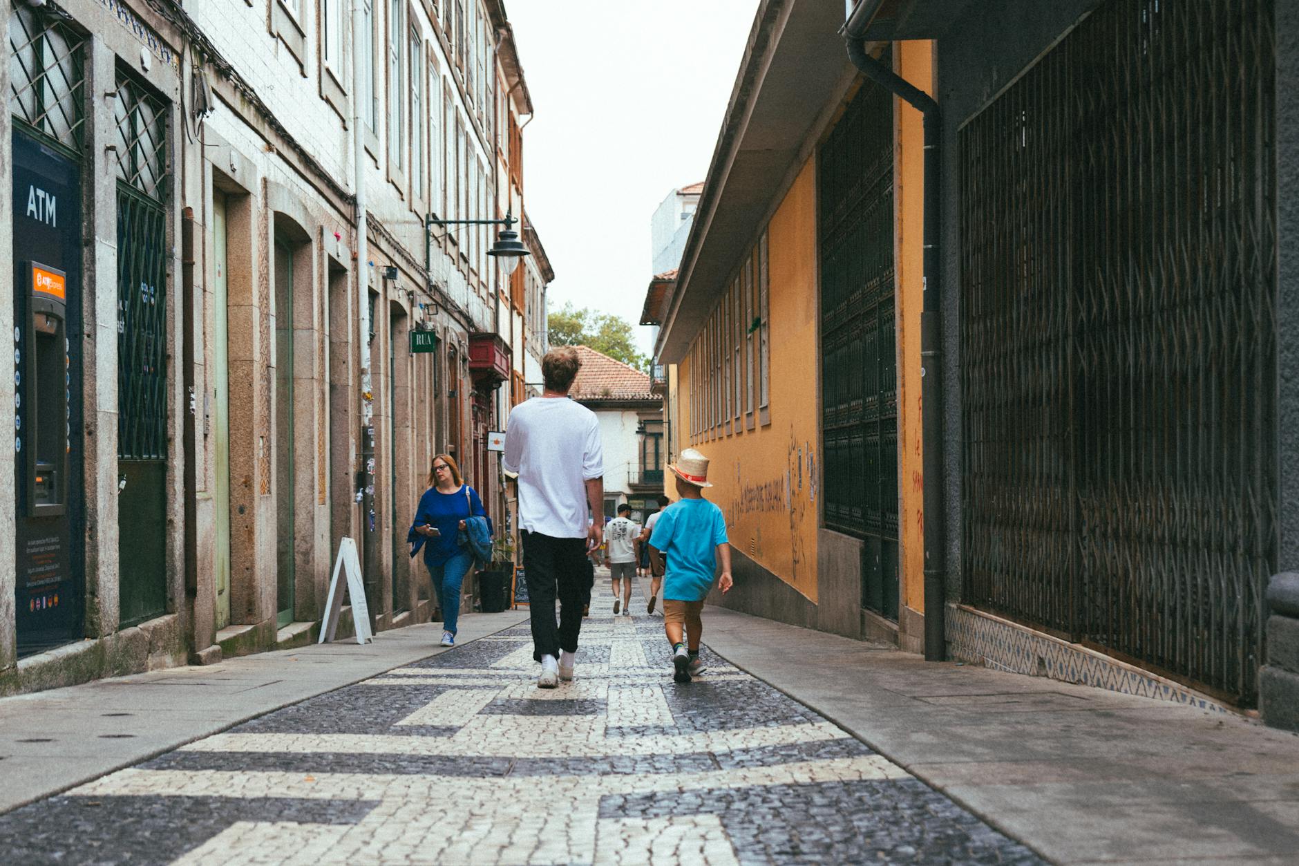 People strolling through a picturesque Porto alley