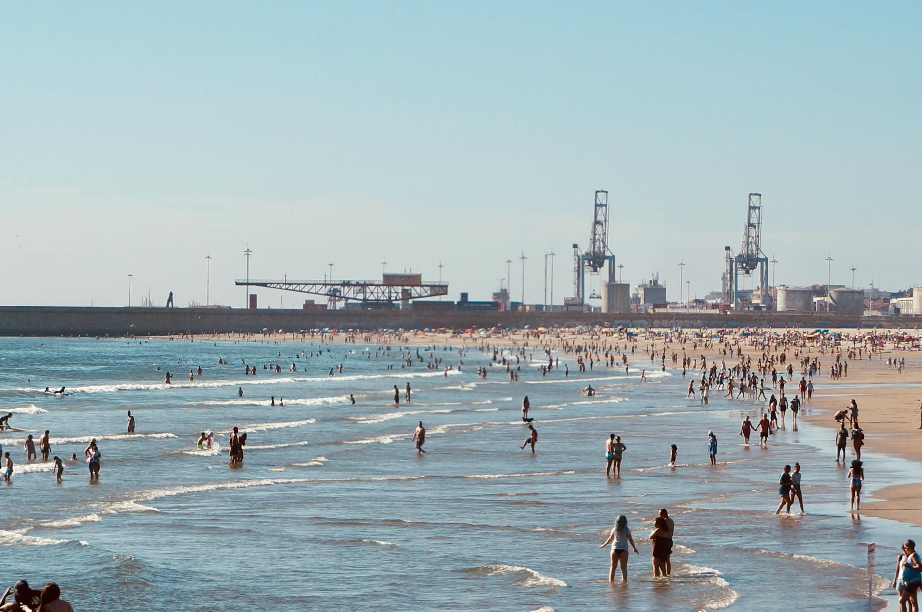 People enjoying a lively day at Matosinhos Beach near Porto