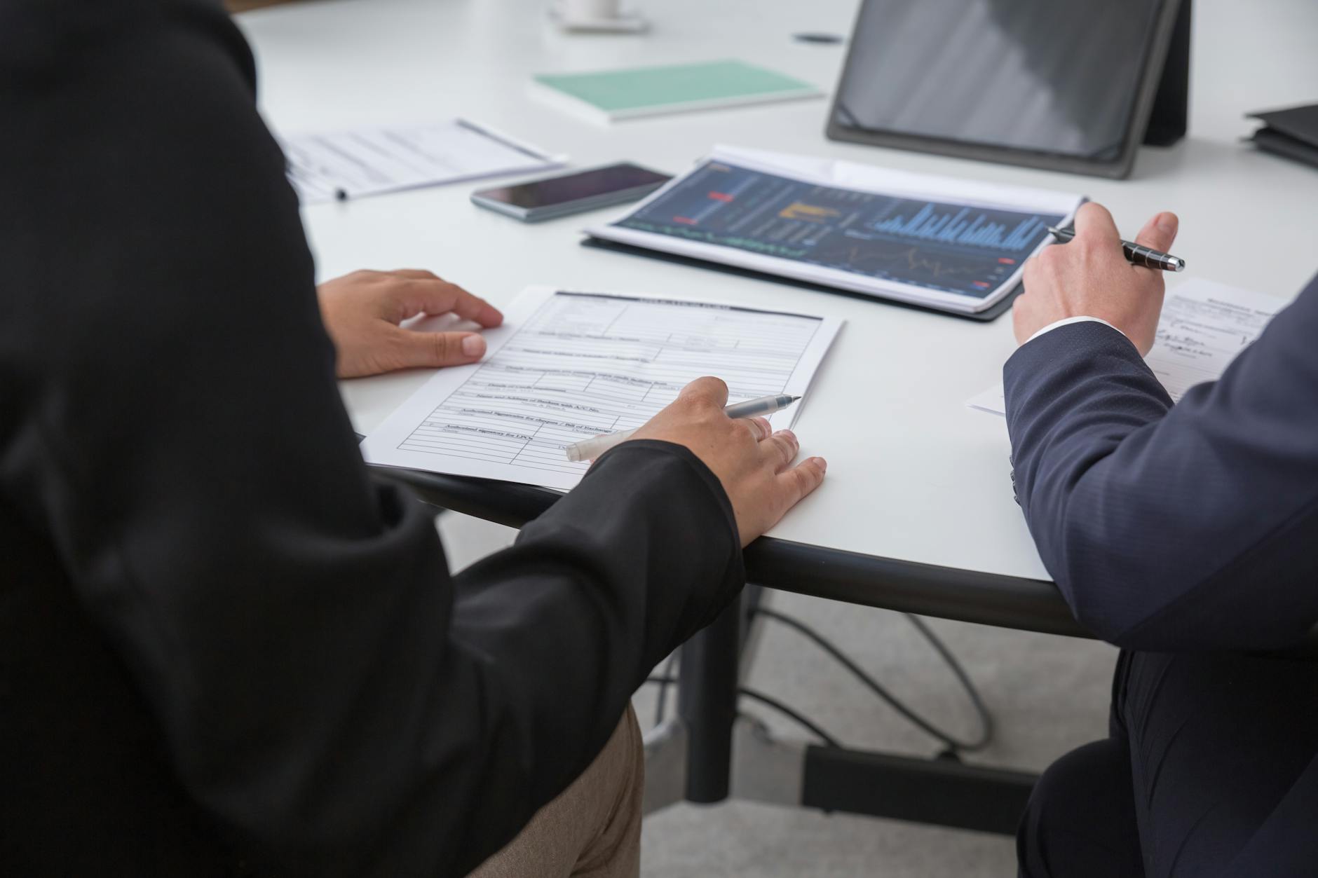 Professionals reviewing analytics documents in an office