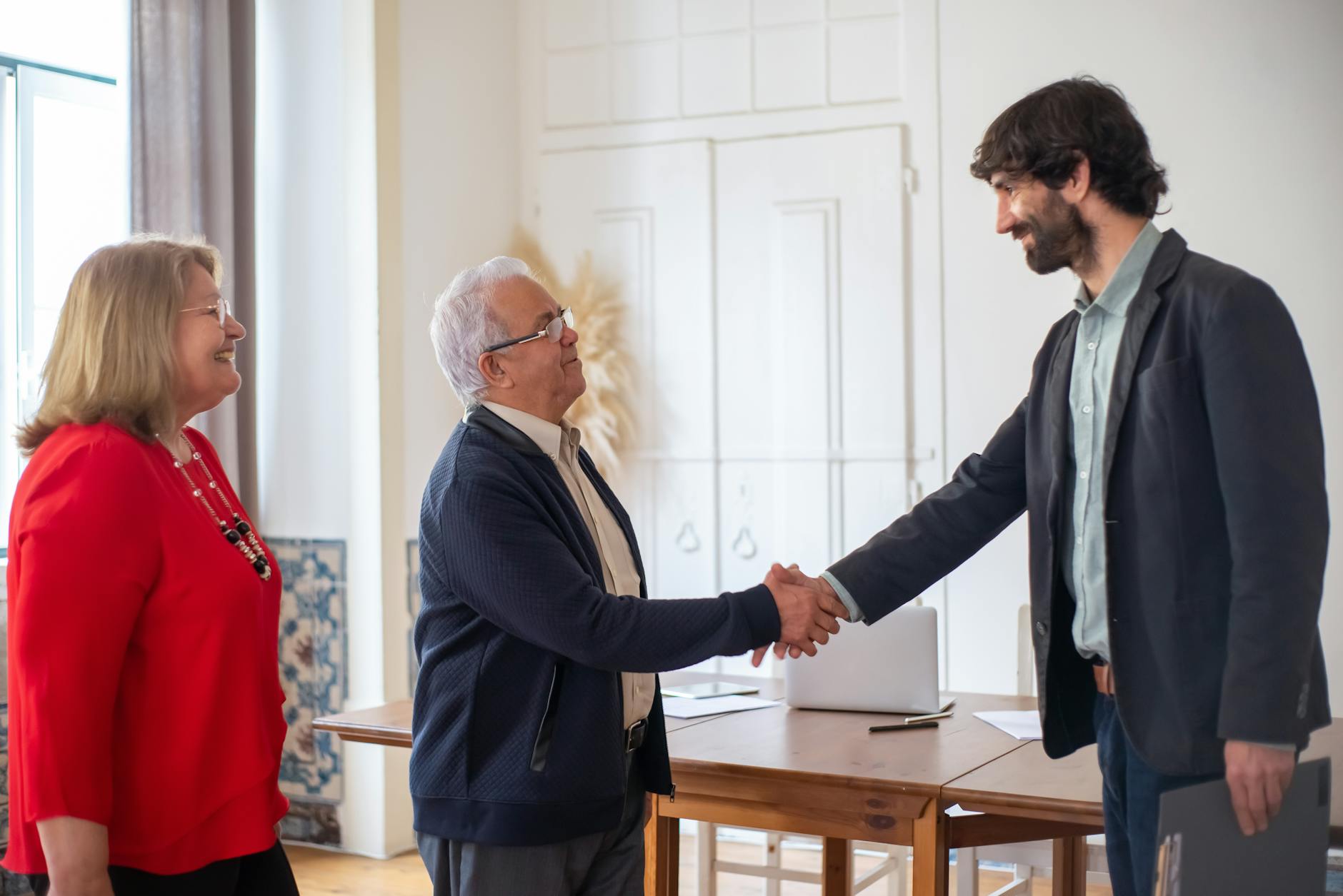 Business deal sealed with a handshake in a bright office