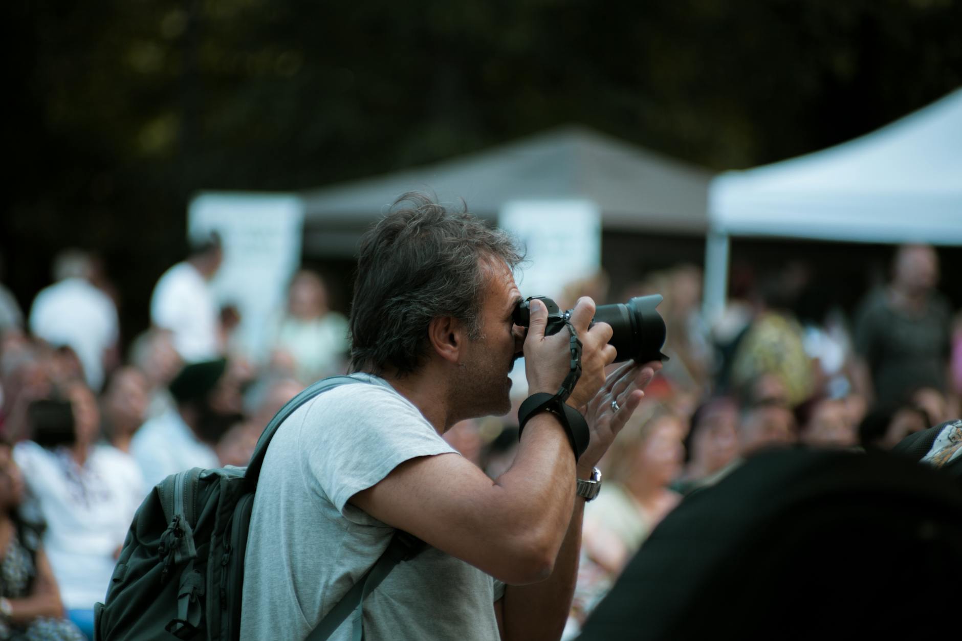 Photographer taking pictures at an outdoor gathering