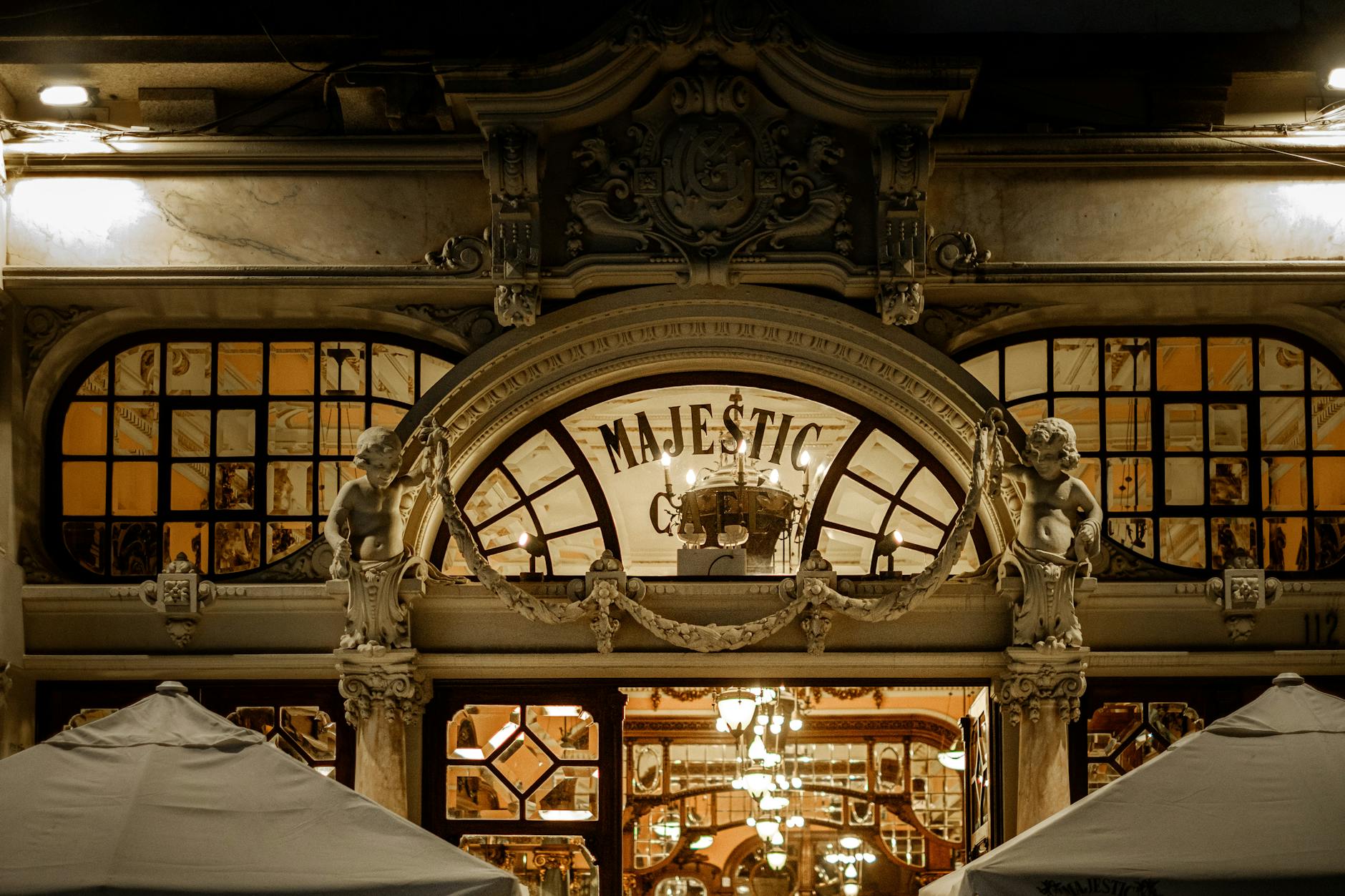 Illuminated facade of Majestic Cafe in Porto at night