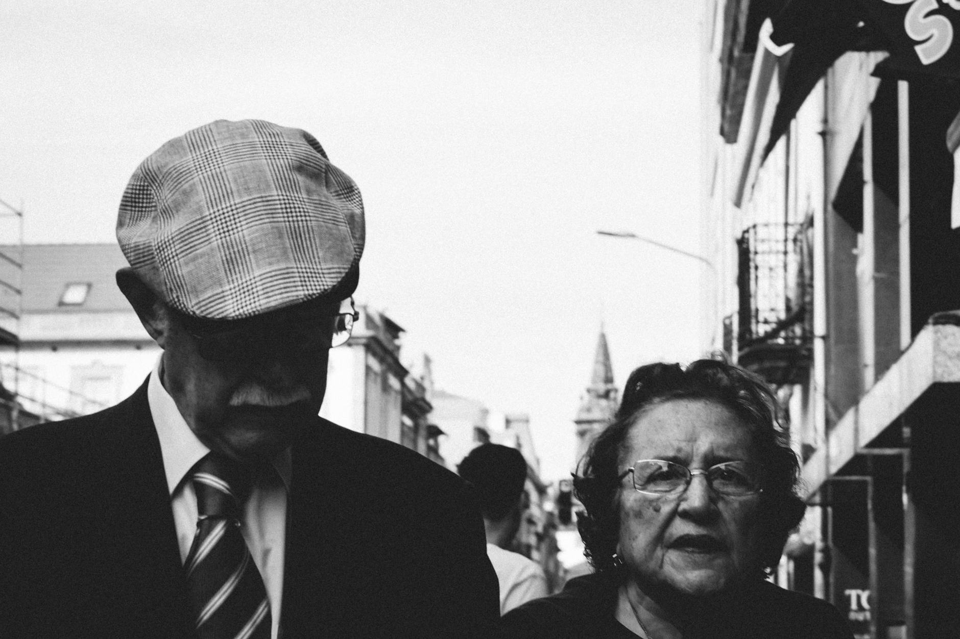 Older couple walking on a Porto city street