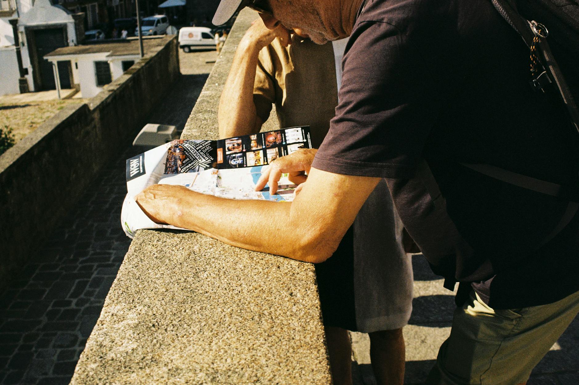 Two tourists using a map while exploring Porto