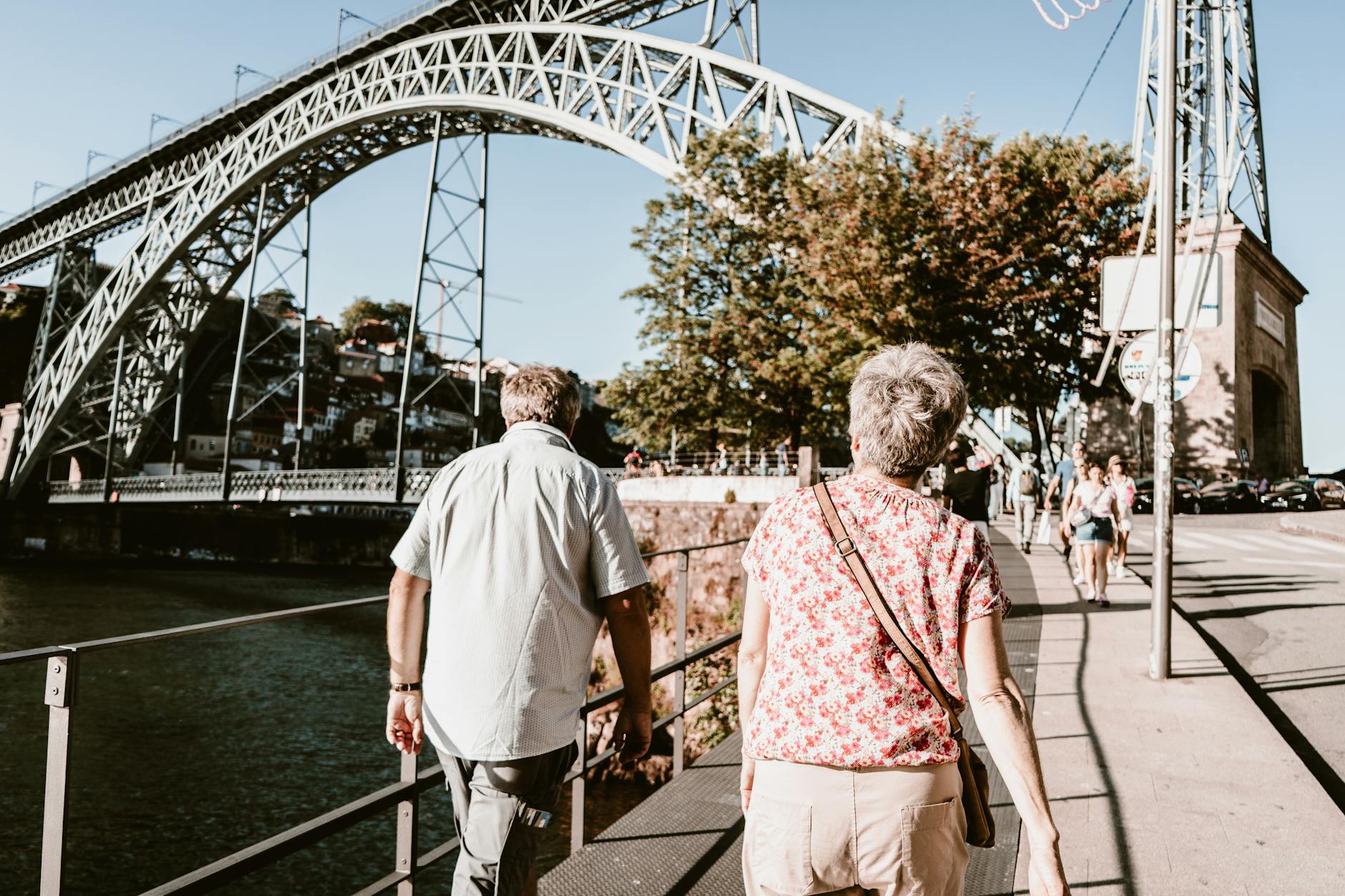 Older couple walking near the Dom Luis I Bridge in Porto