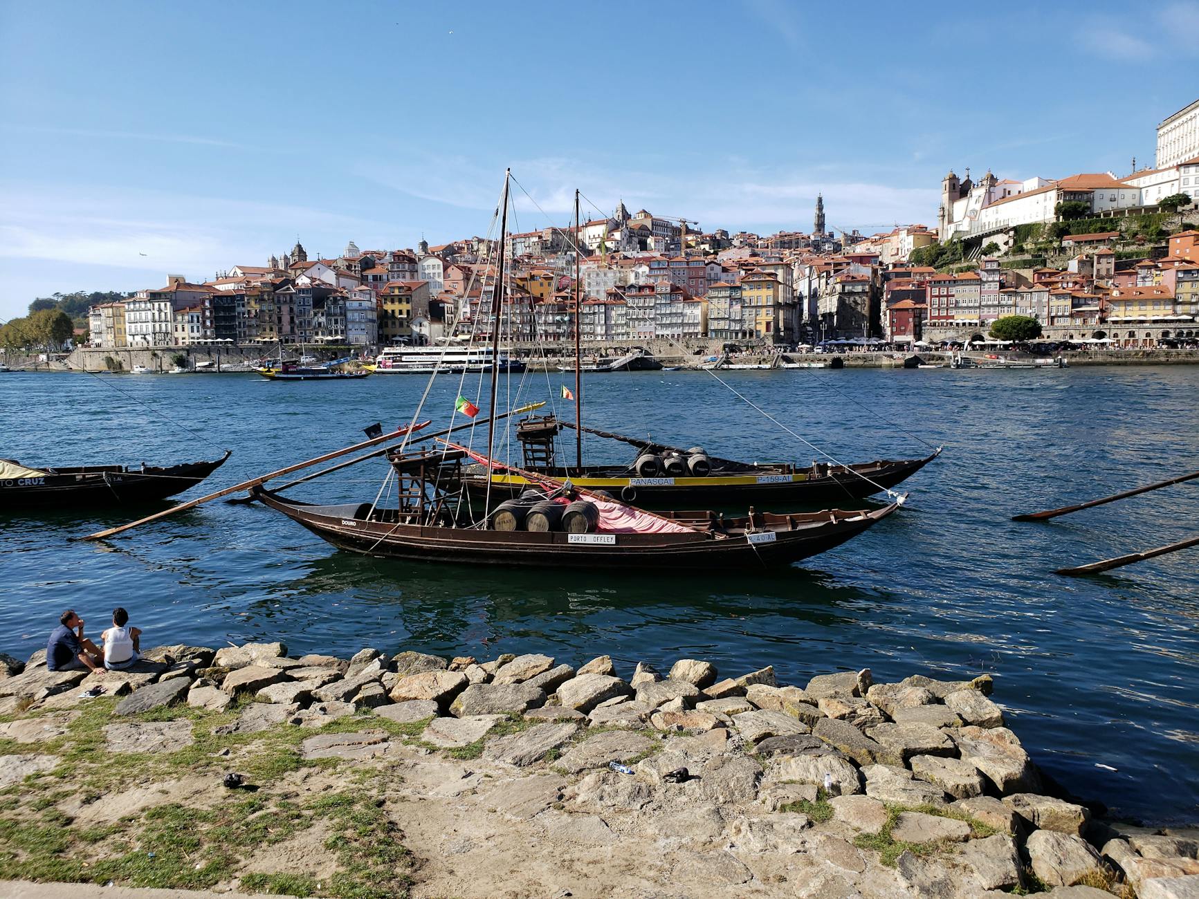 Traditional boats on the Douro River with Porto behind them