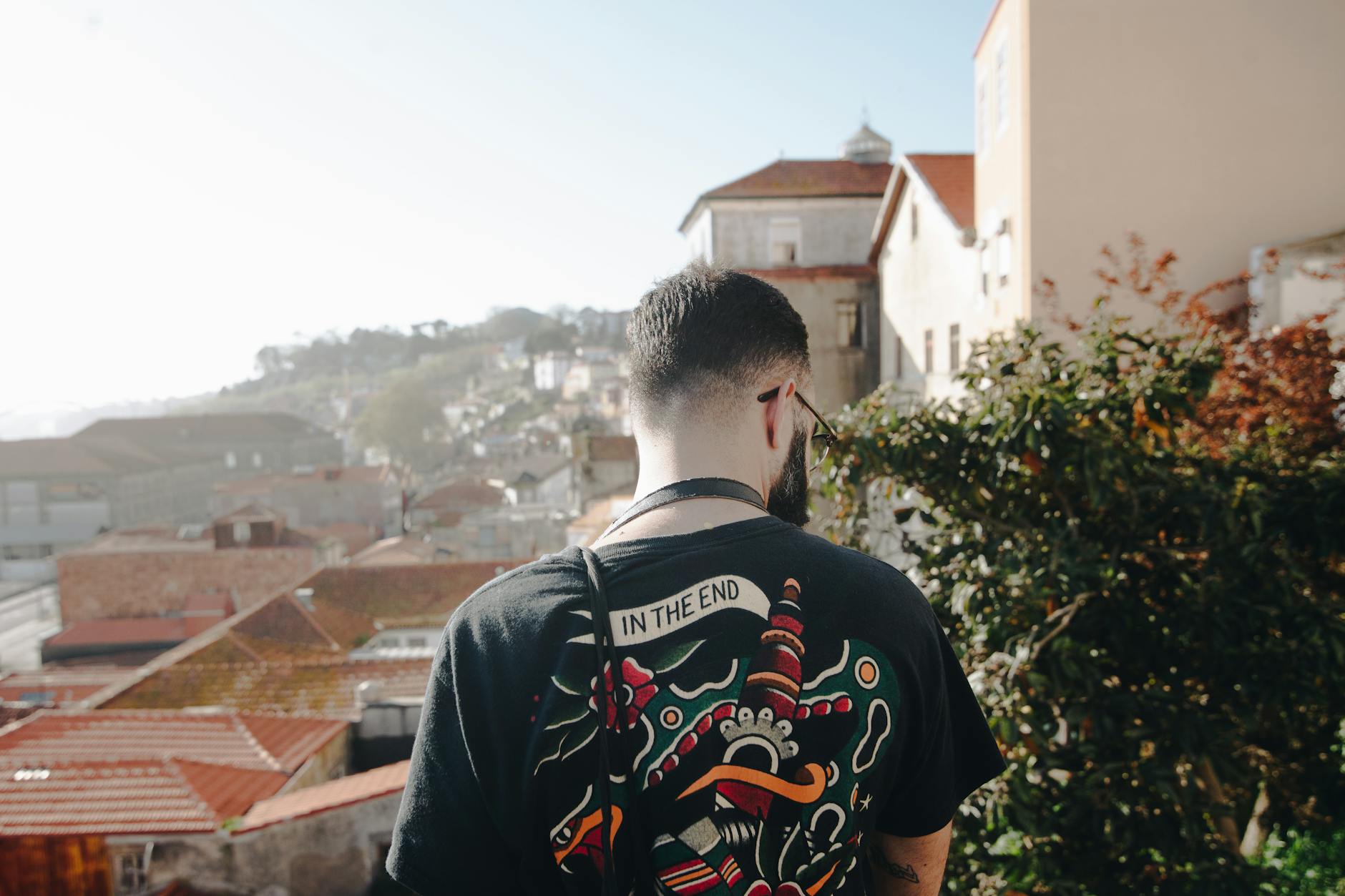 Solo traveler looking over the Porto cityscape on a sunny day