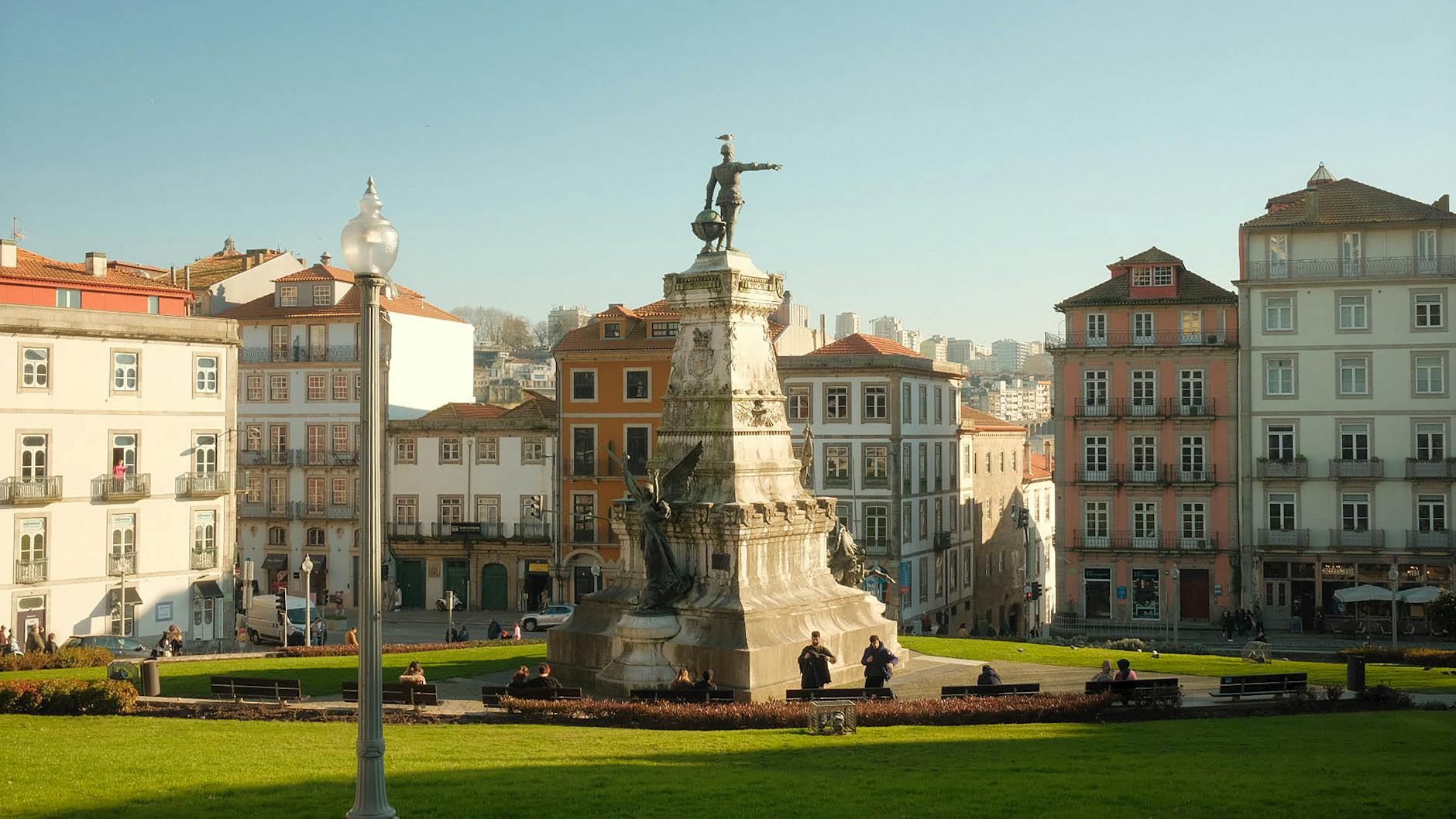 Statue in a historic Porto square with traditional architecture