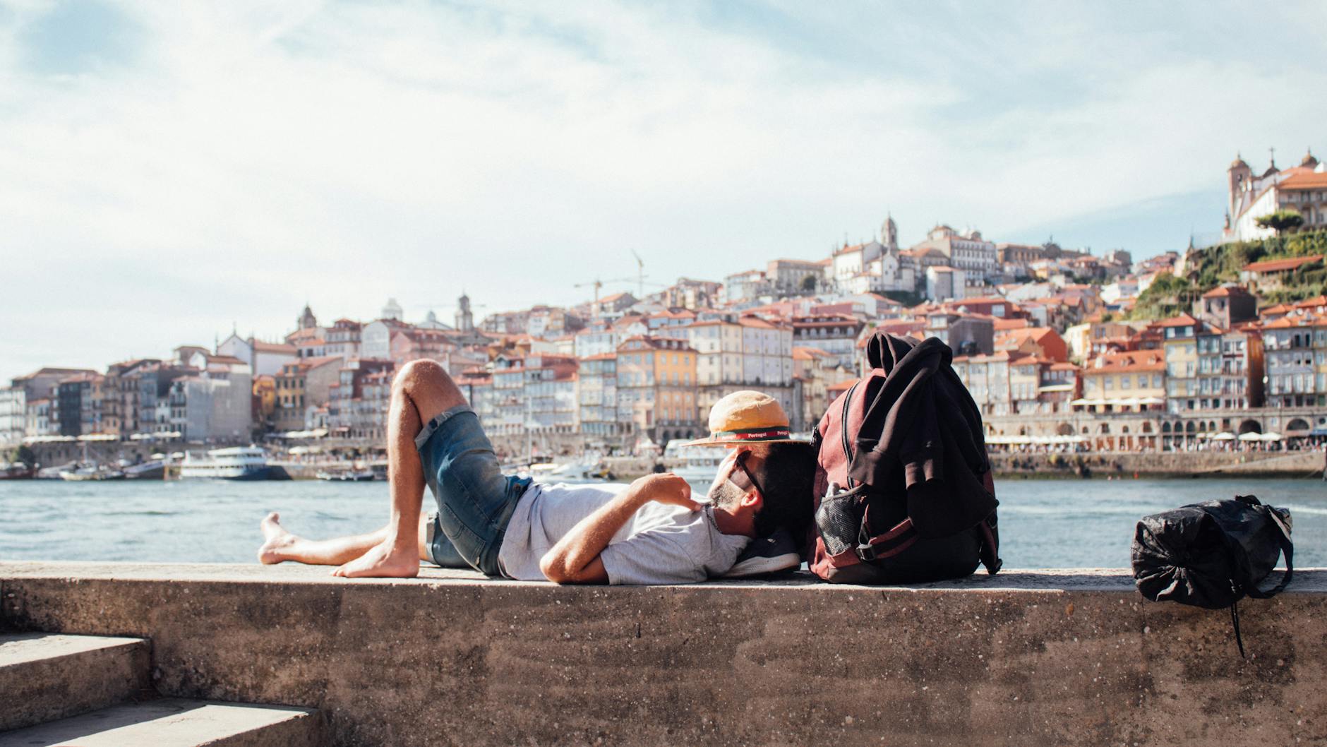 Young person relaxing by the riverside in Porto