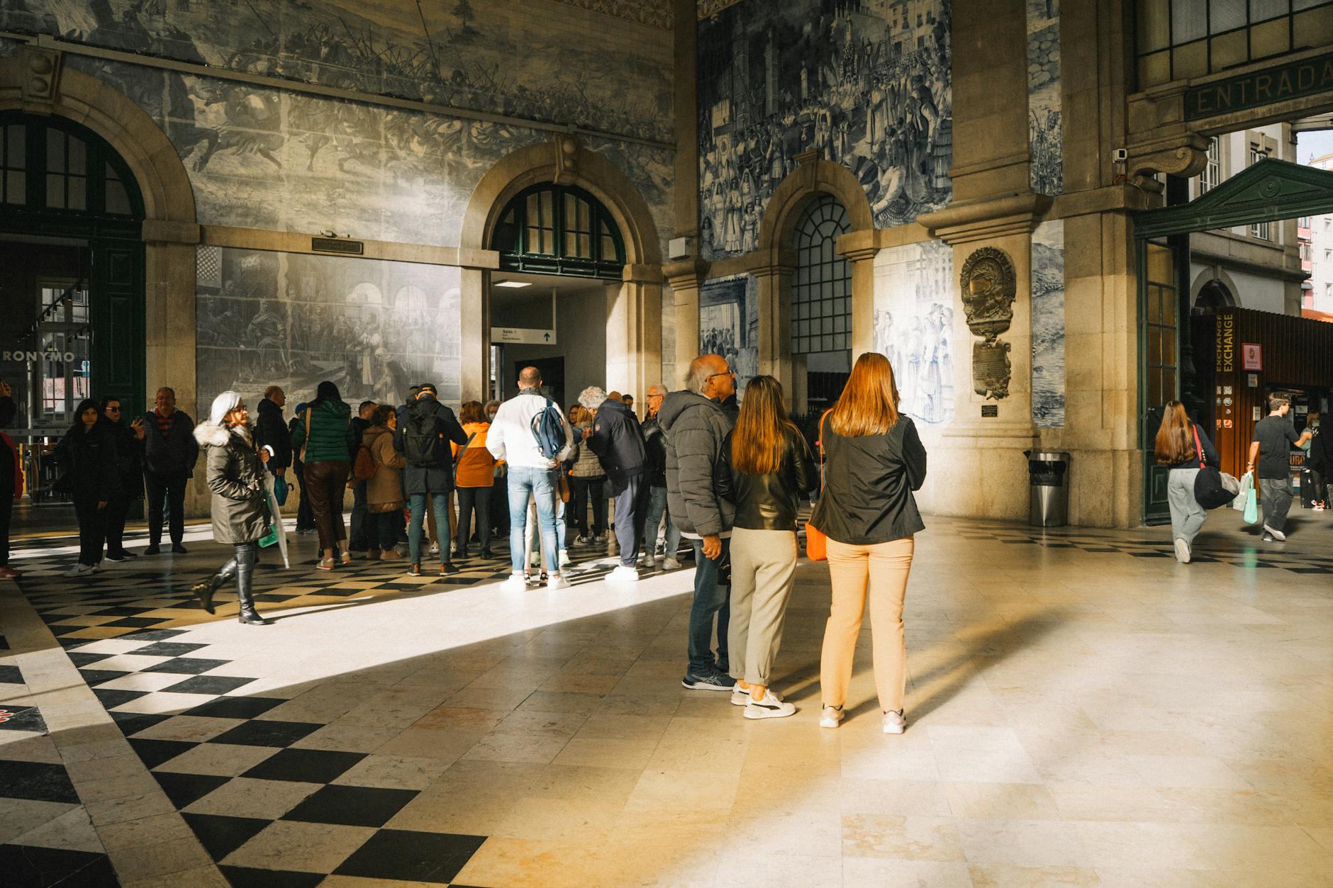 Visitors inside Sao Bento station in Porto