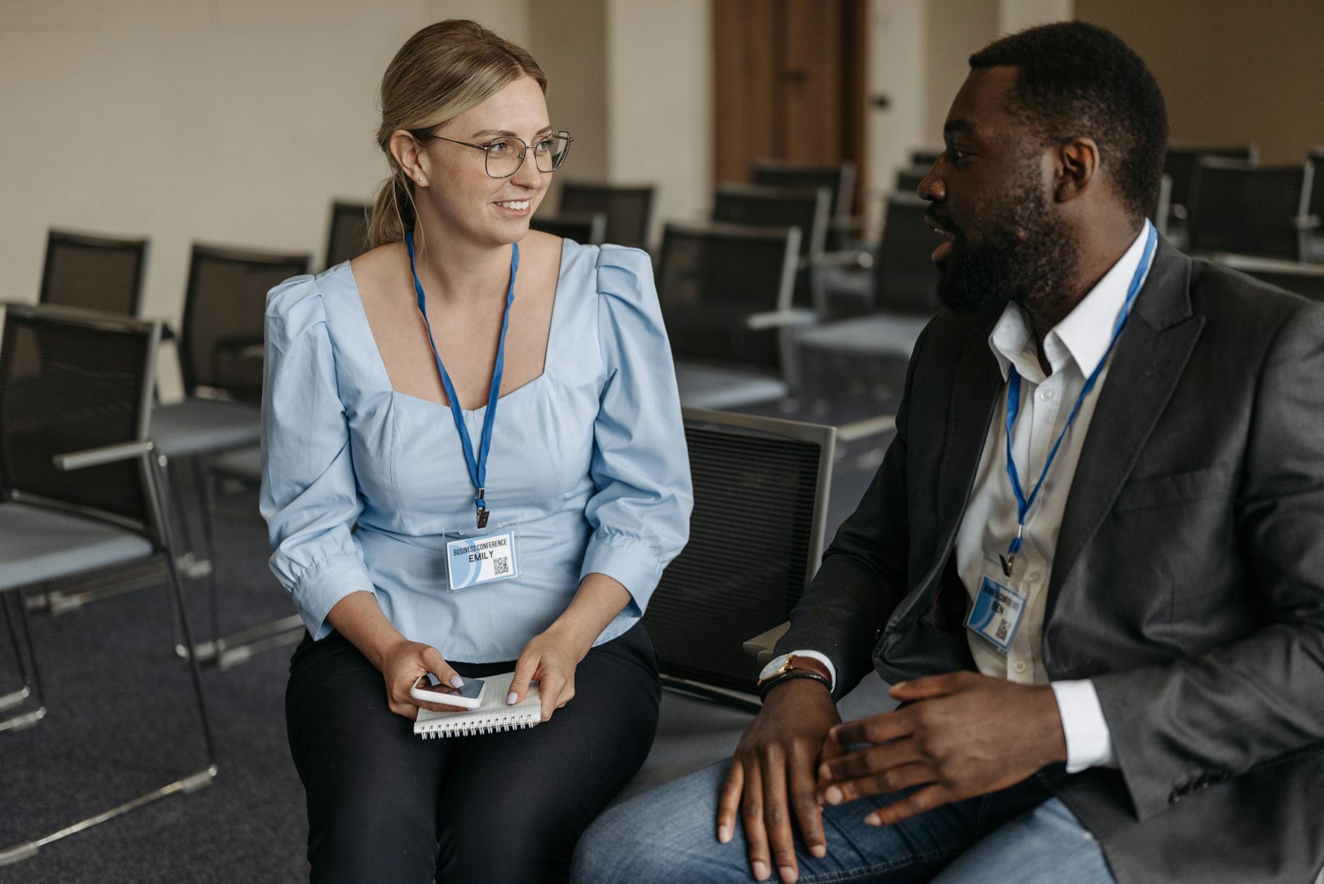 Professionals wearing badges during a business discussion