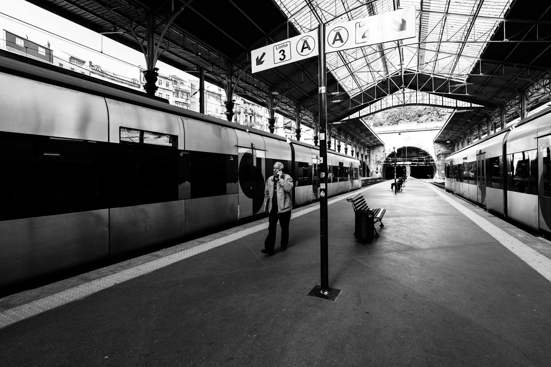Person walking through Sao Bento train station in Porto