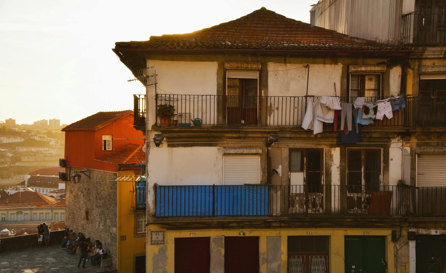 Residential Porto facade with laundry drying in warm light